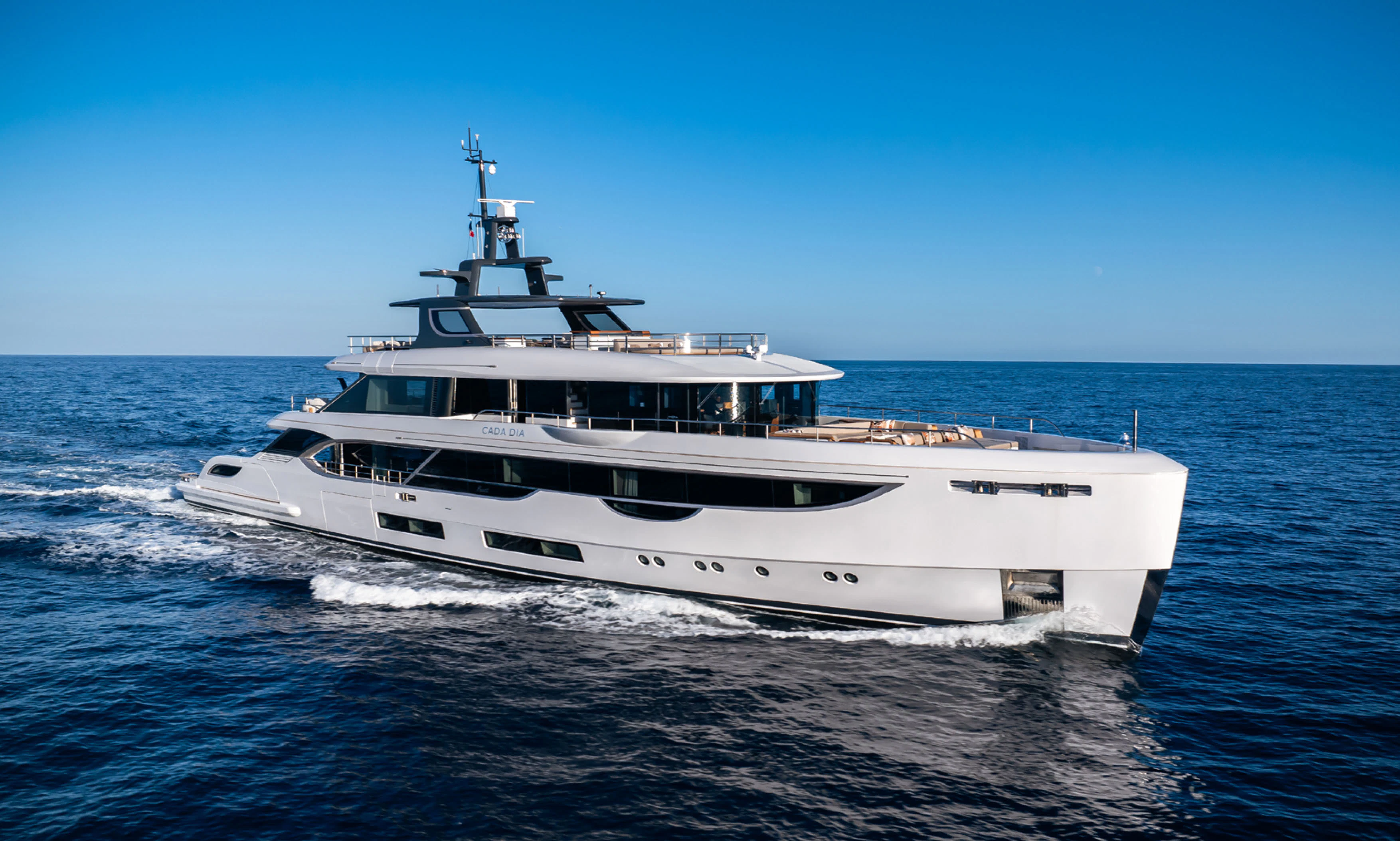 a white yacht on the water aboard CADA DIA Yacht for Charter