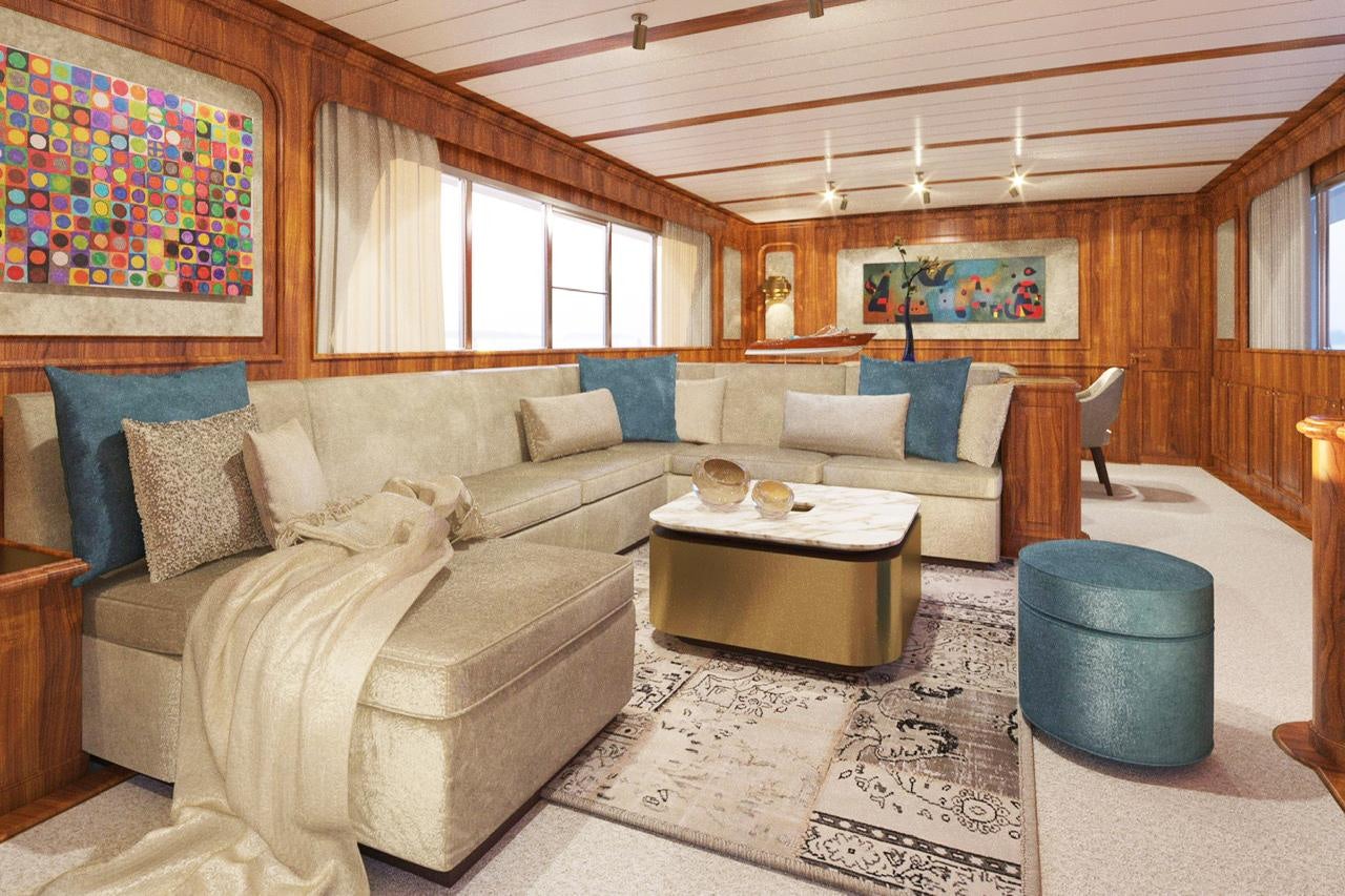 a living room with a couch and a table aboard A&A Yacht for Charter