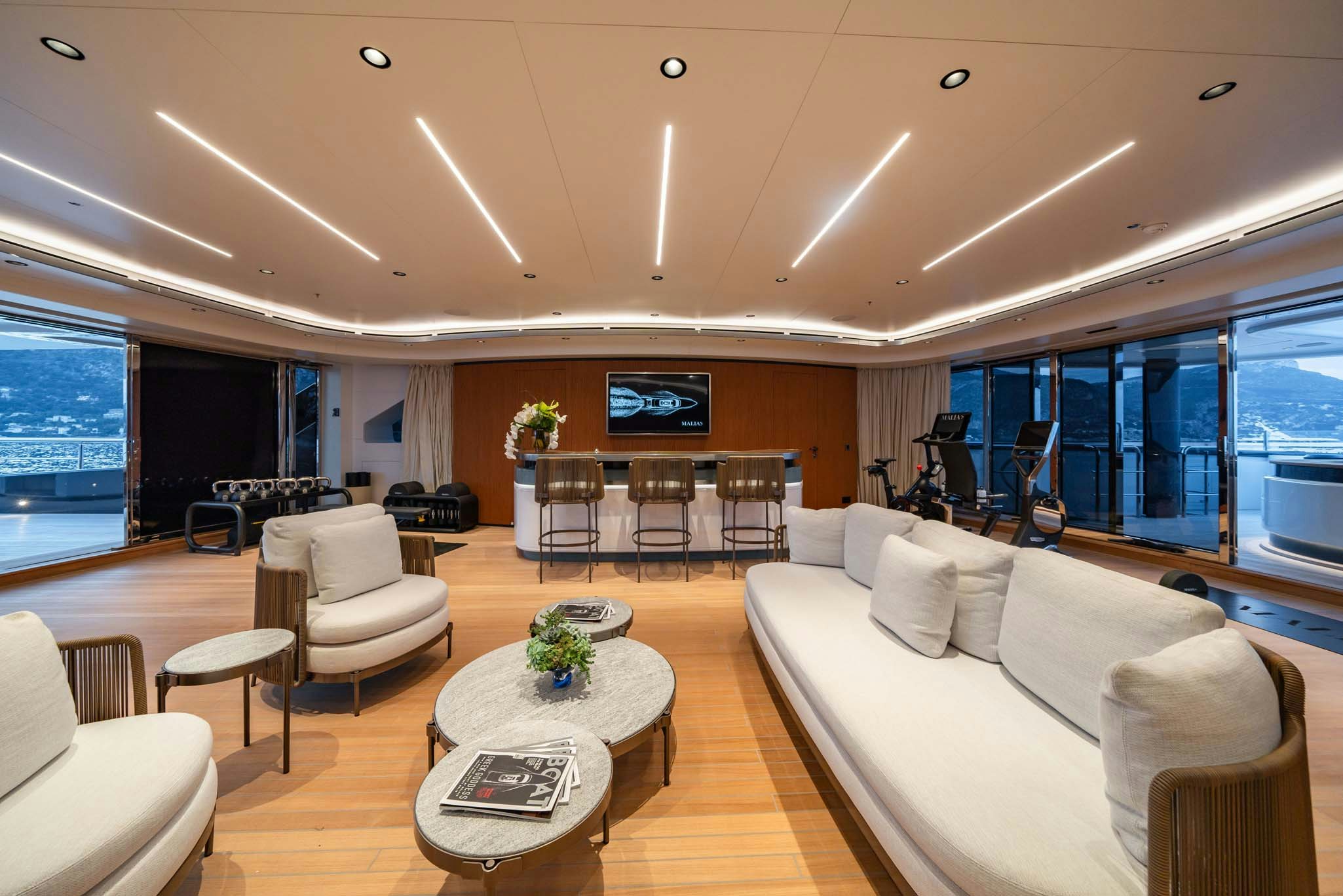 a living room with a large window aboard MALIA Yacht for Charter