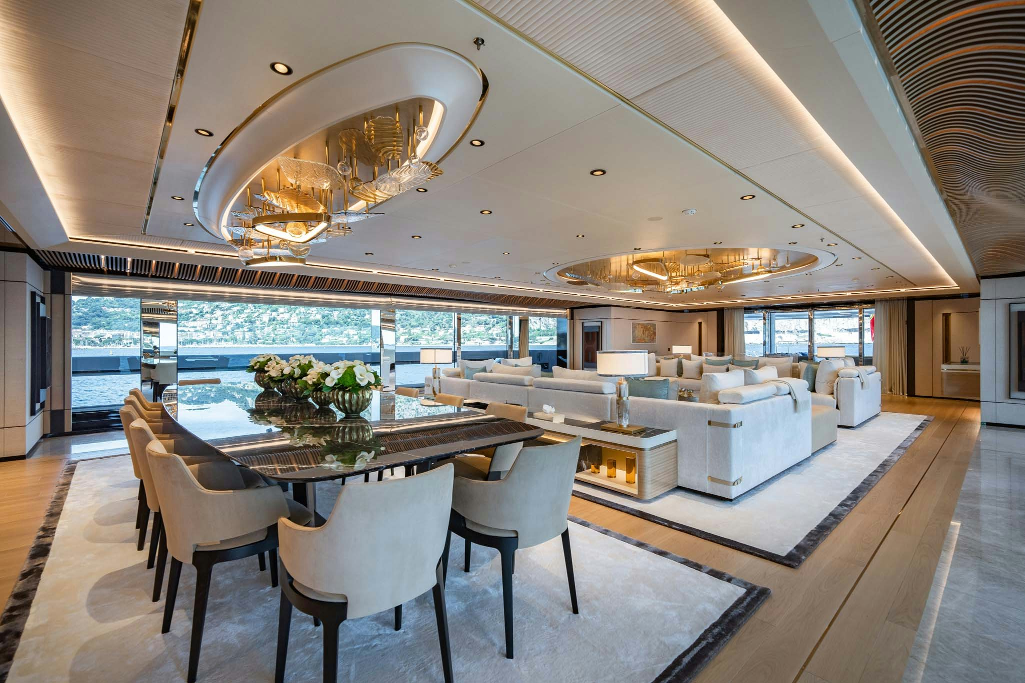 a large kitchen with a large dining table and chairs aboard MALIA Yacht for Charter