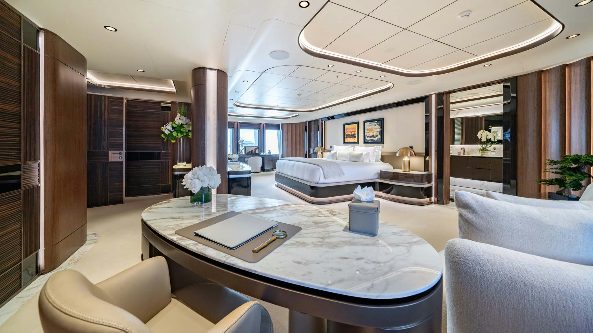 a large living room with a large white table and couches aboard MALIA Yacht for Charter