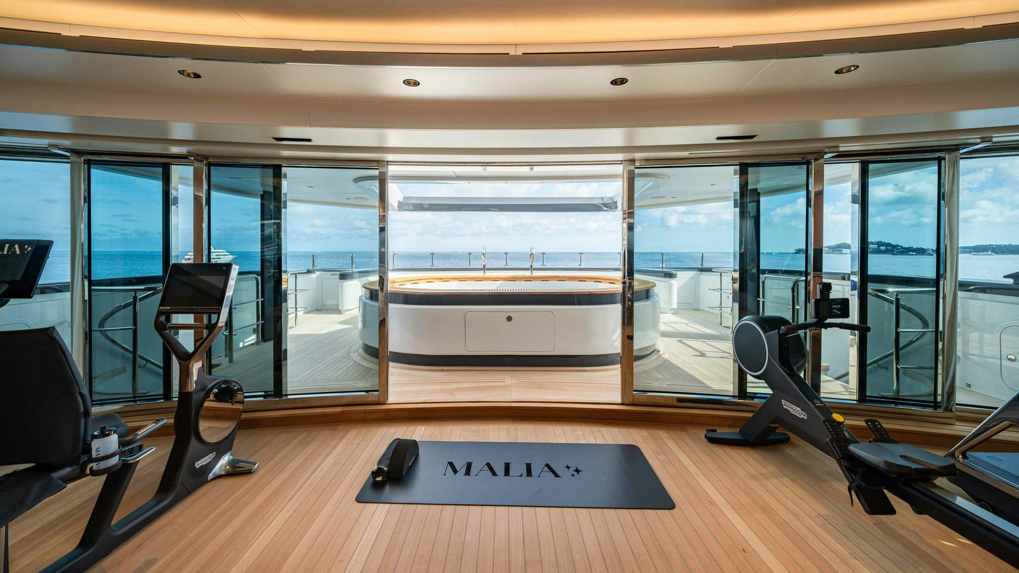 a gym with a mat on the floor aboard MALIA Yacht for Charter