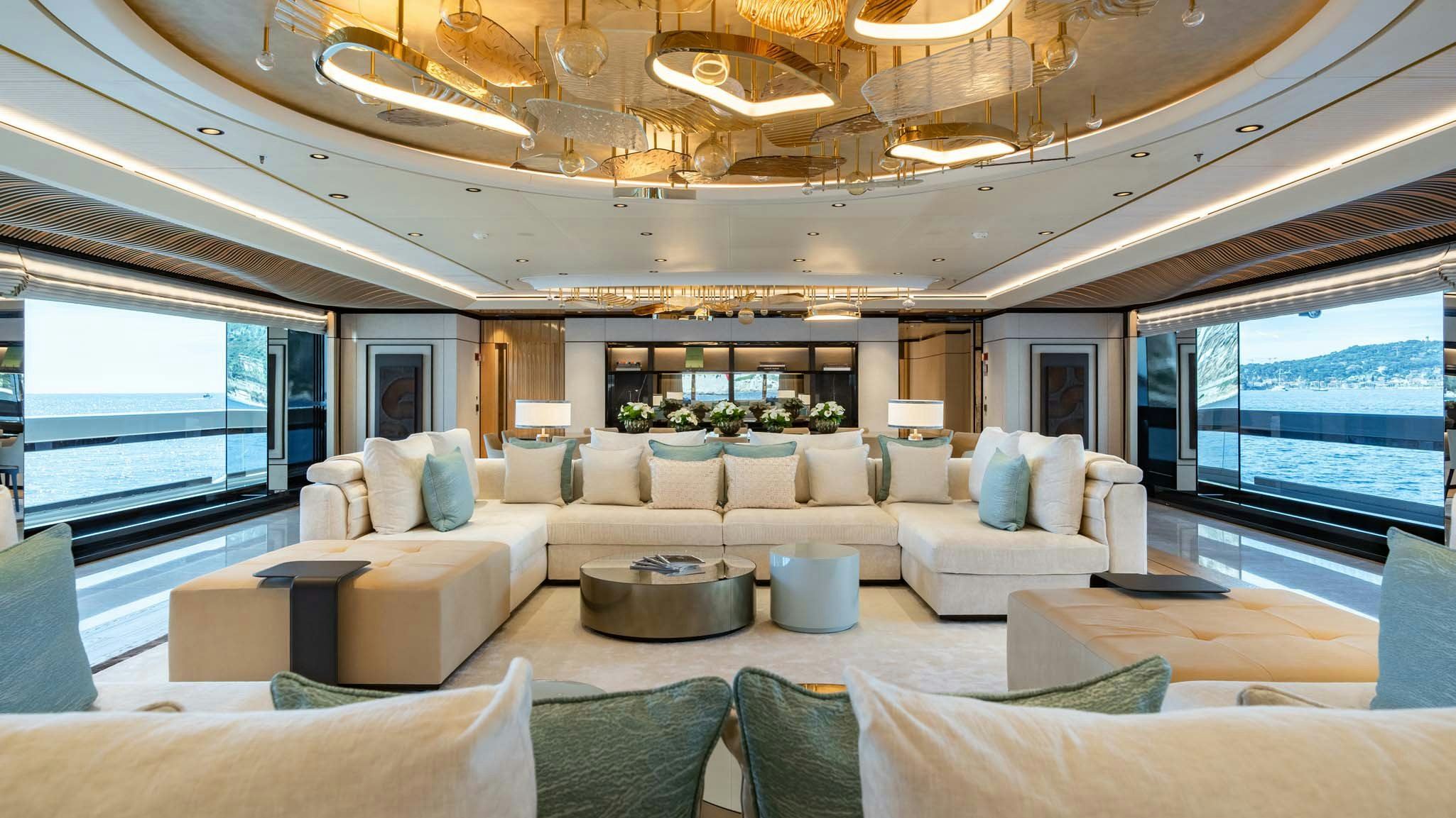 a living room with a large window aboard MALIA Yacht for Charter