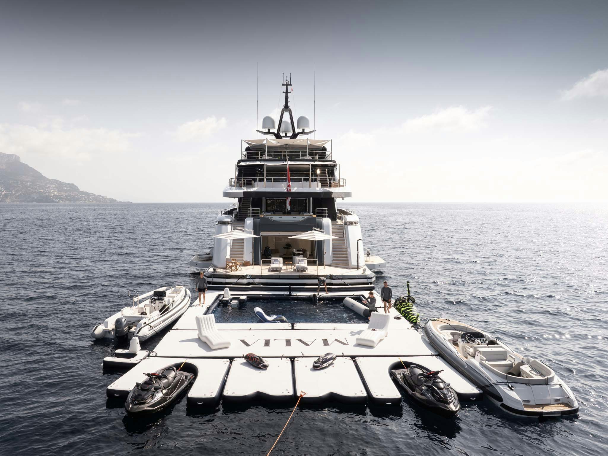 a large ship in the water aboard MALIA Yacht for Charter