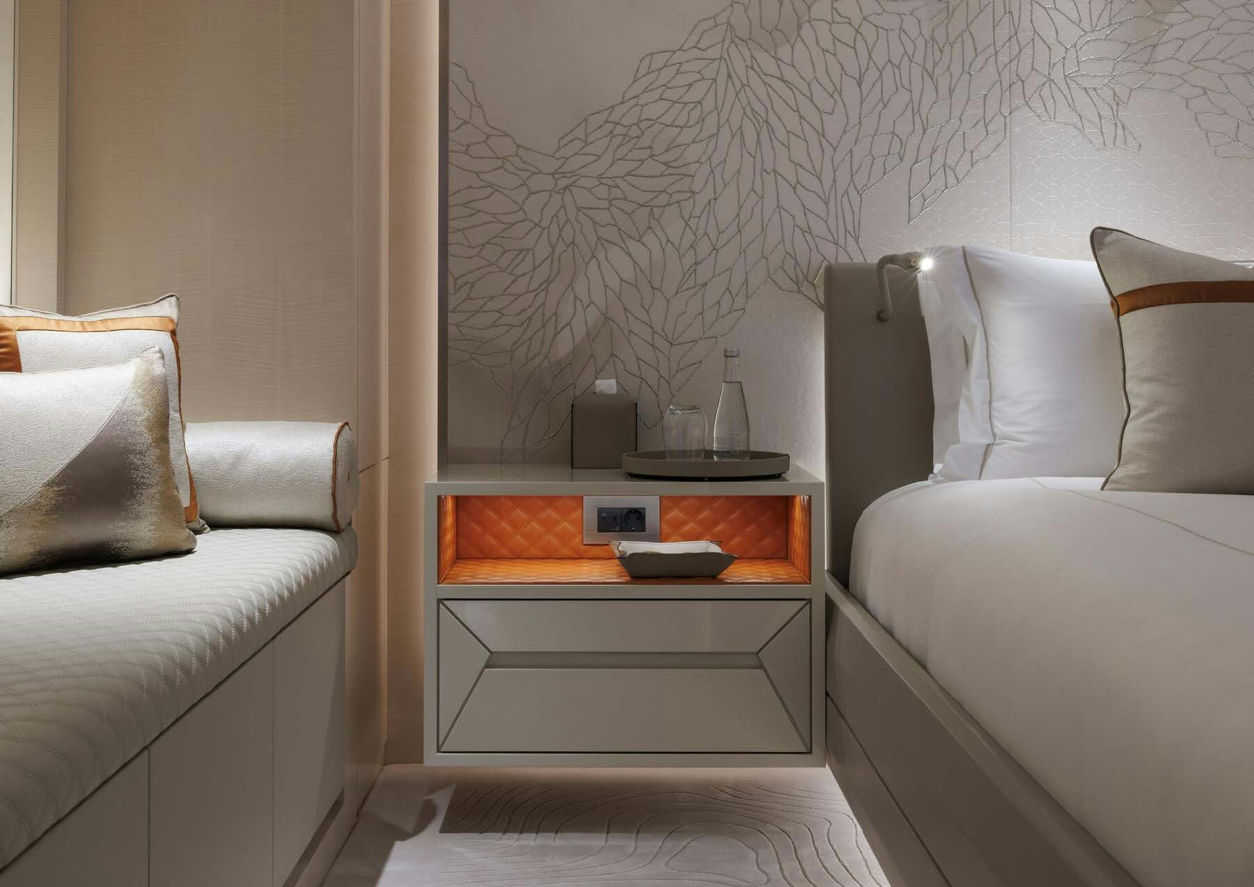 a white couch and a white coffee table in a room aboard H3 Yacht for Sale