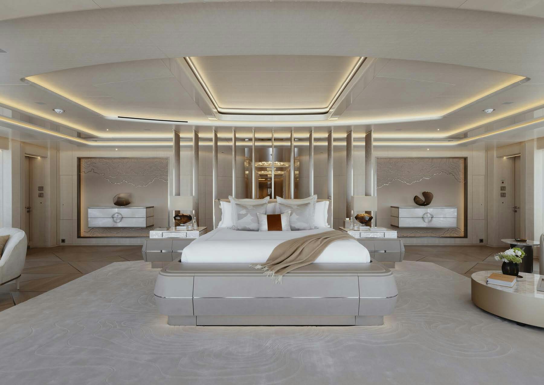 a large white bedroom with a large white bed and a large white chandelier aboard H3 Yacht for Sale