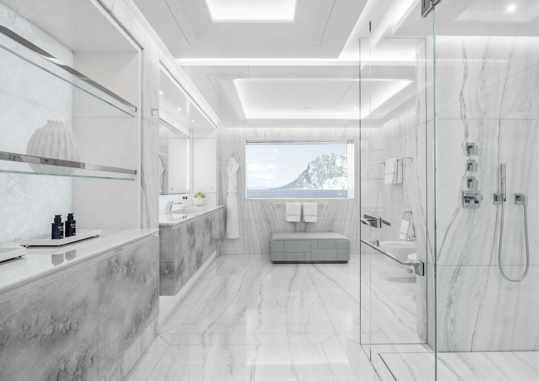 a bathroom with a glass shower aboard H3 Yacht for Sale