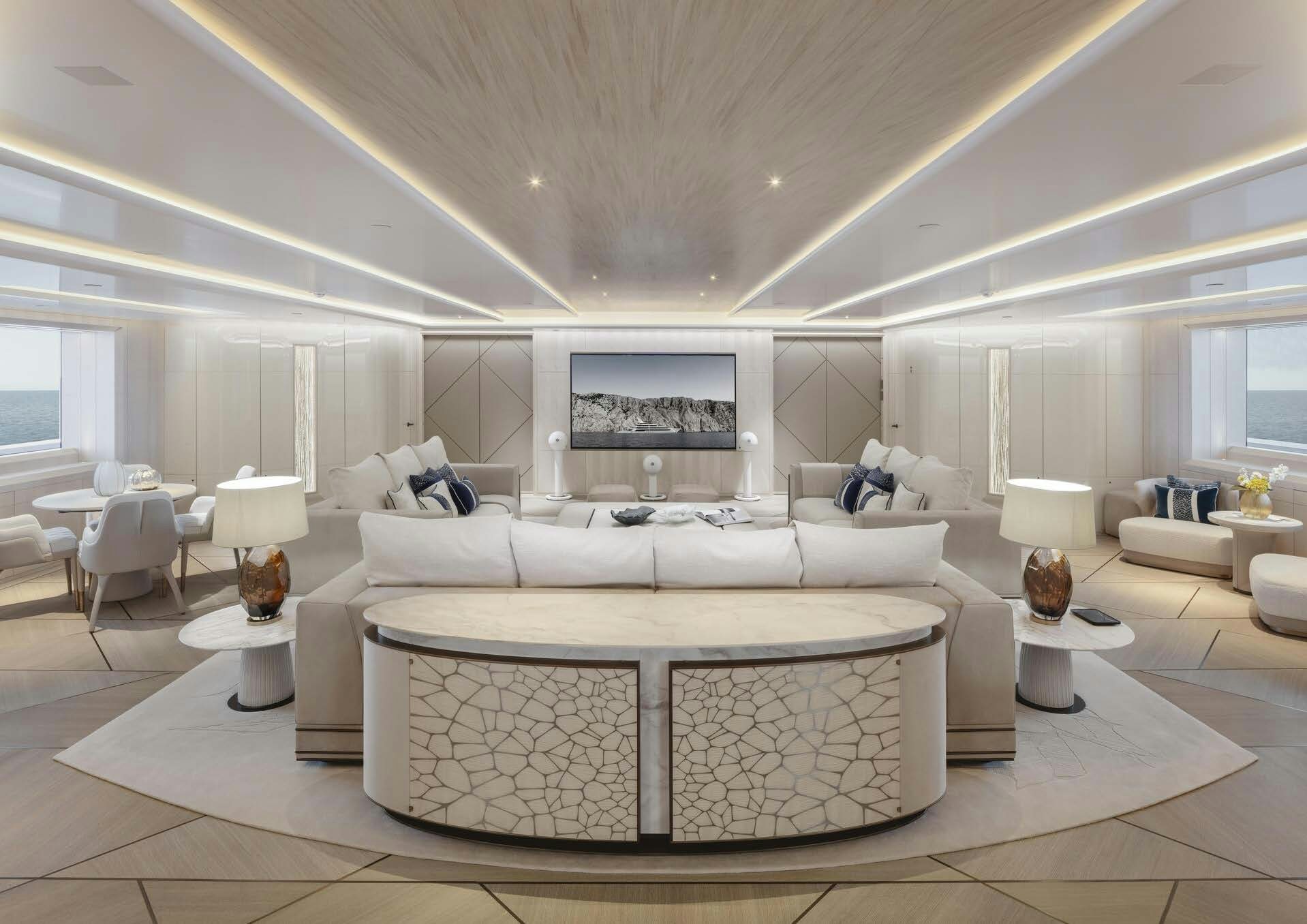 a living room with a large white couch and a large flat screen tv aboard H3 Yacht for Sale