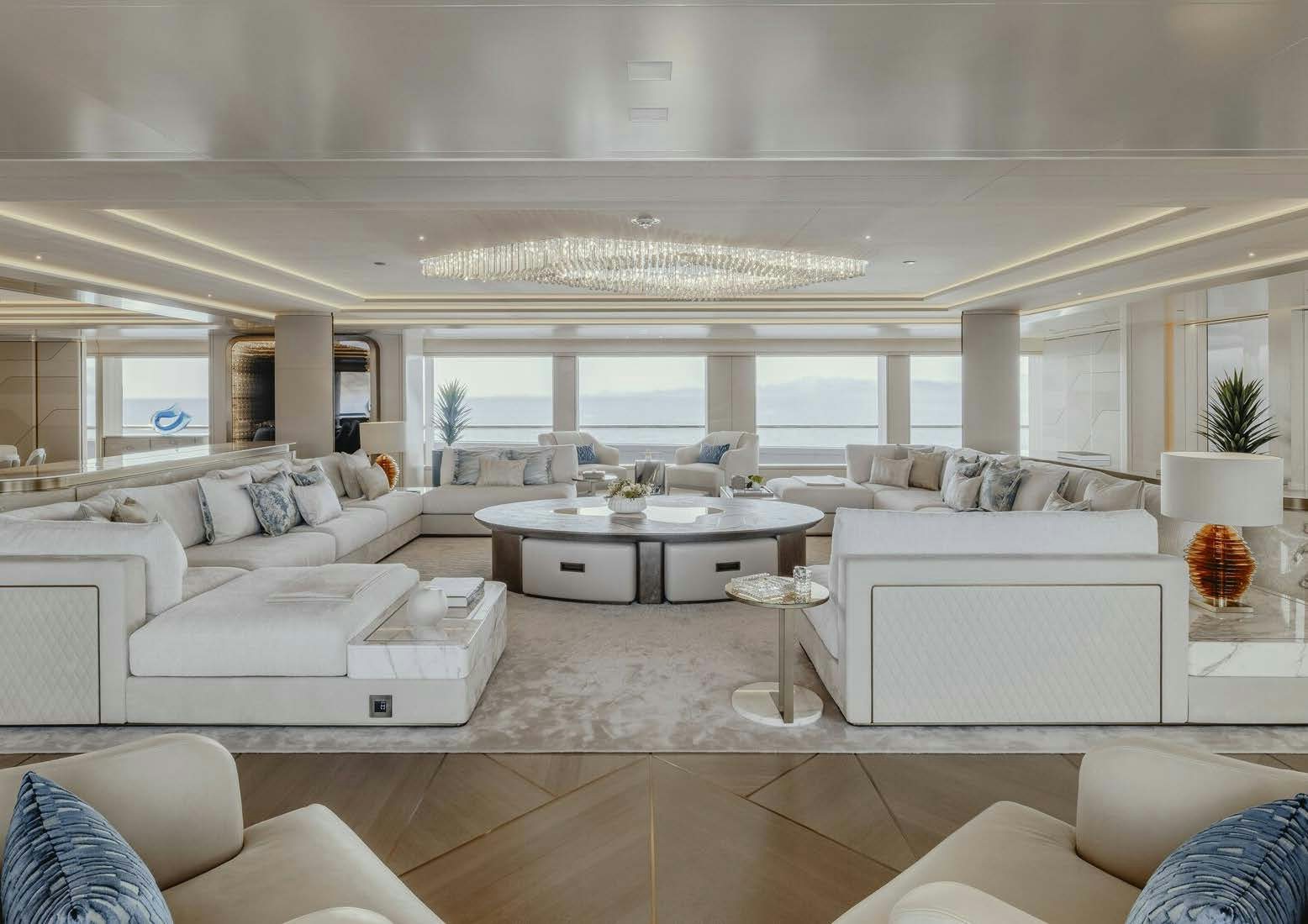 a living room with white furniture aboard H3 Yacht for Sale