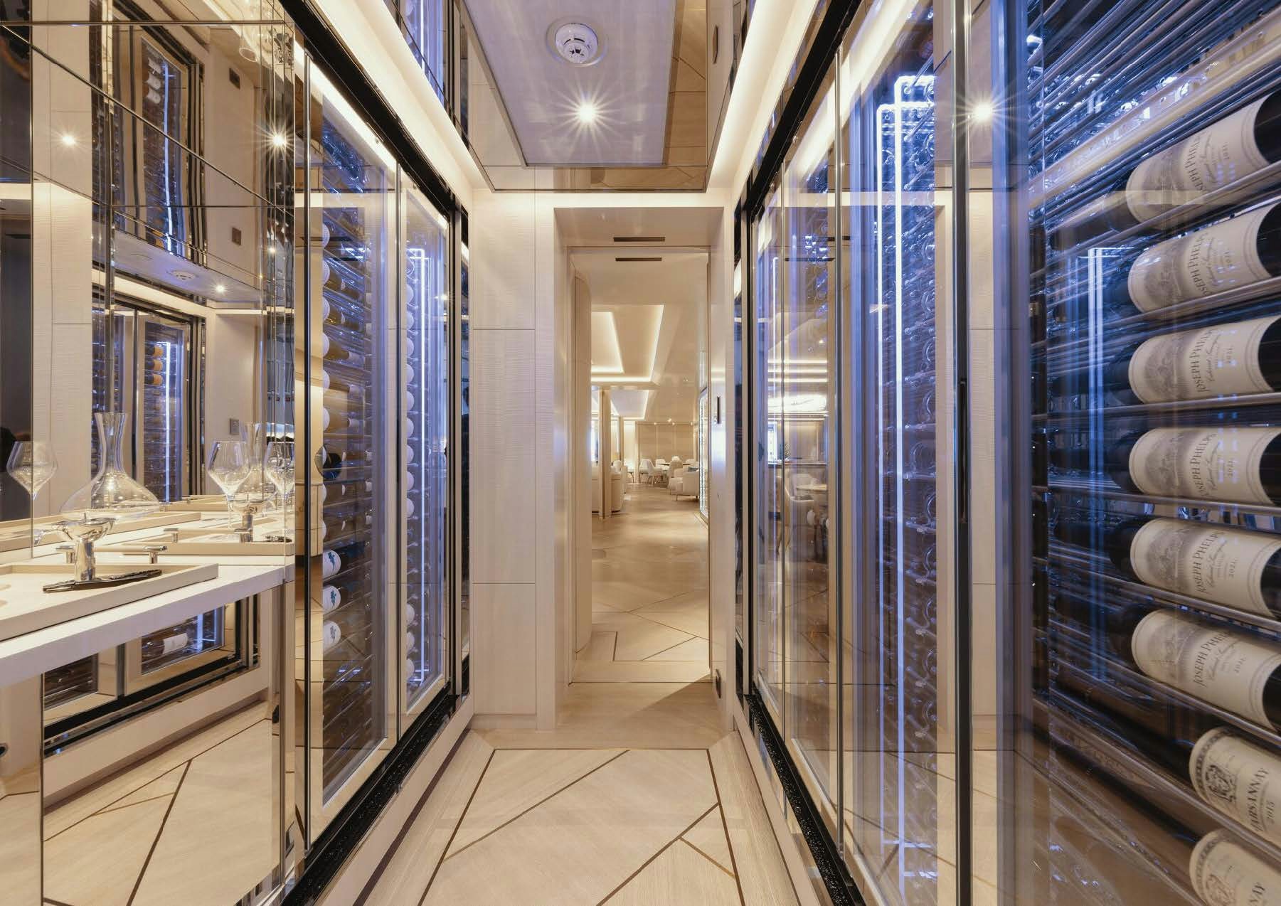 a room with shelves and cabinets aboard H3 Yacht for Sale