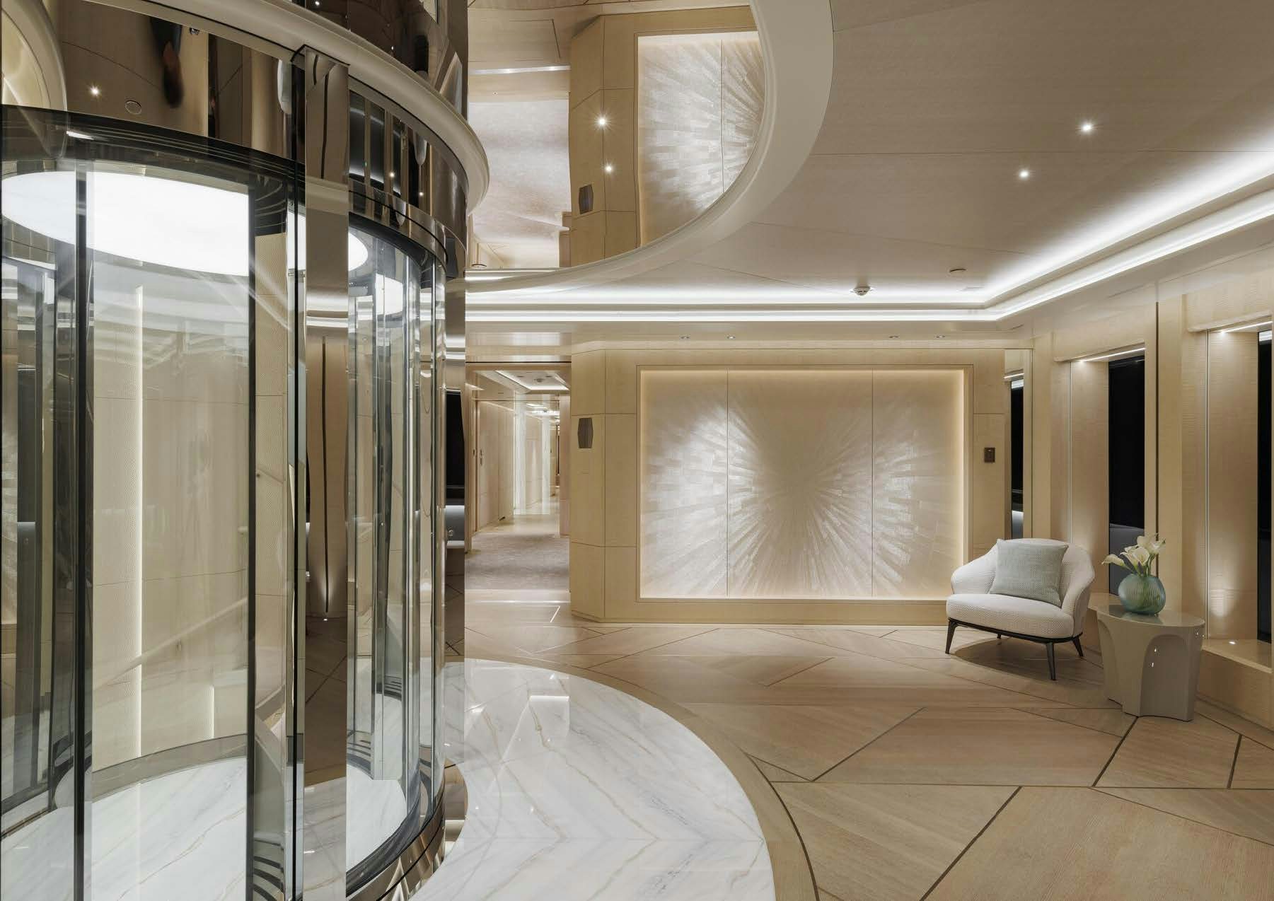 a large room with glass walls aboard H3 Yacht for Sale