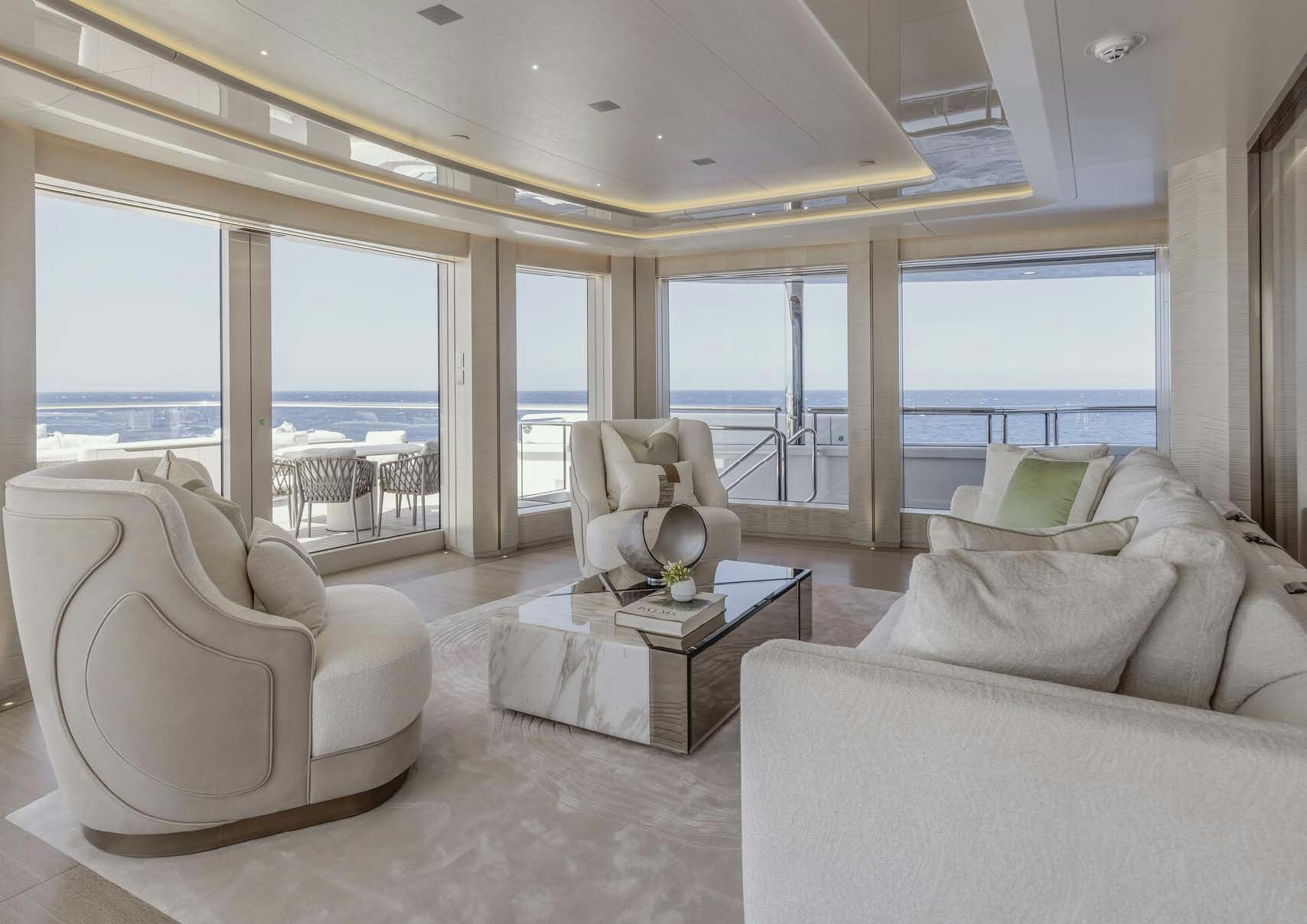 a living room with a large window aboard H3 Yacht for Sale
