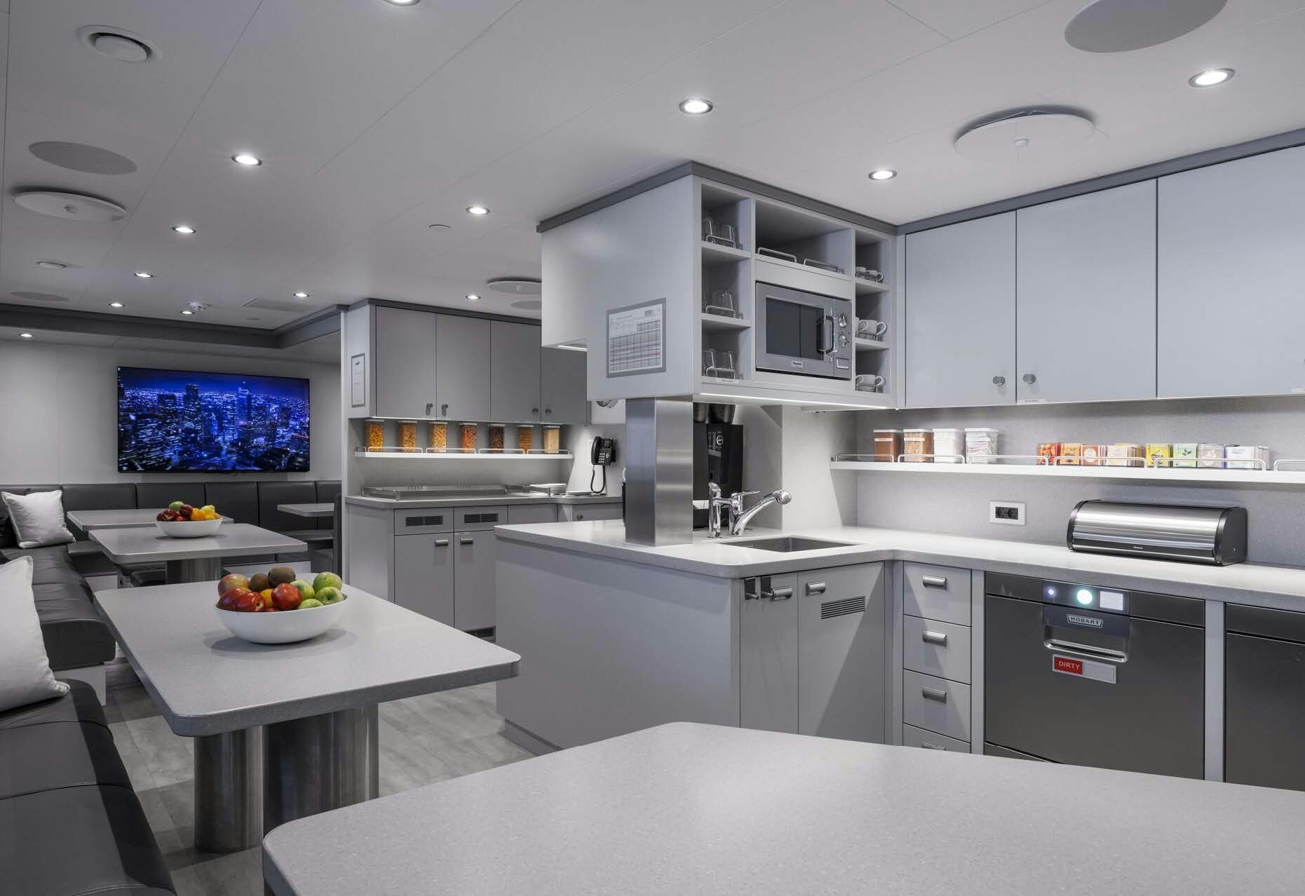 a kitchen with white cabinets aboard H3 Yacht for Sale