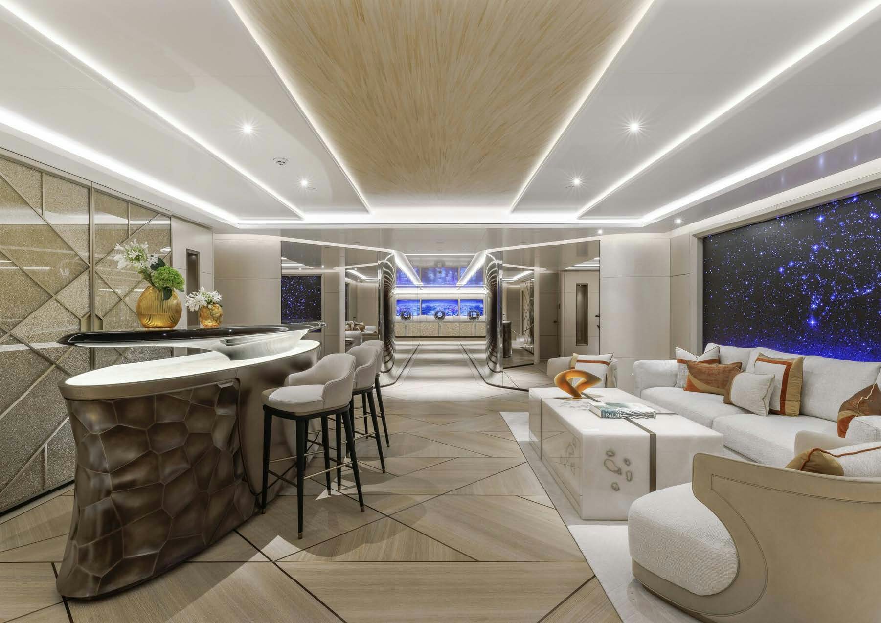 a modern living room with a large glass table and white couches aboard H3 Yacht for Sale