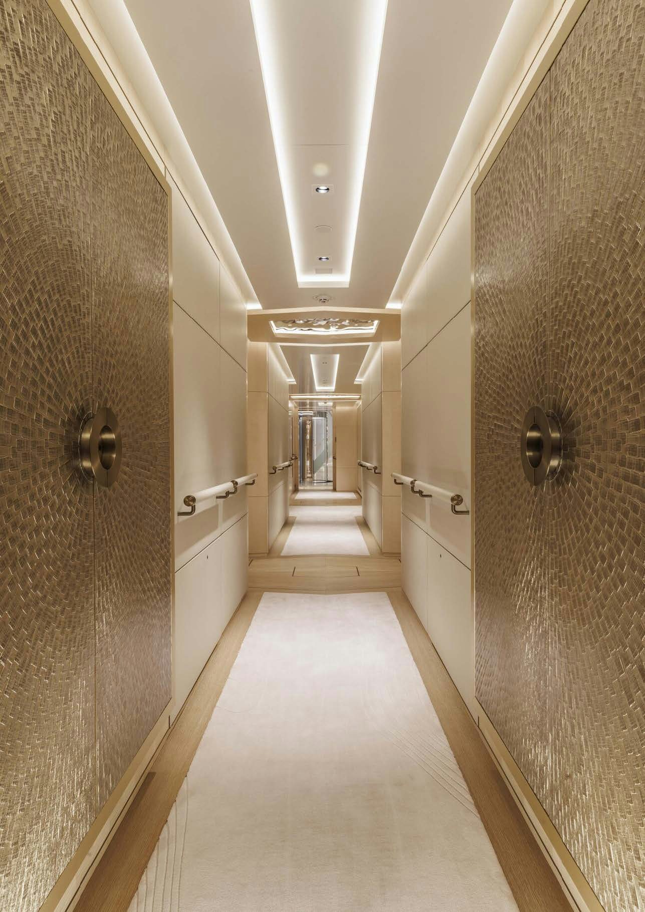 a long hallway with a door aboard H3 Yacht for Sale