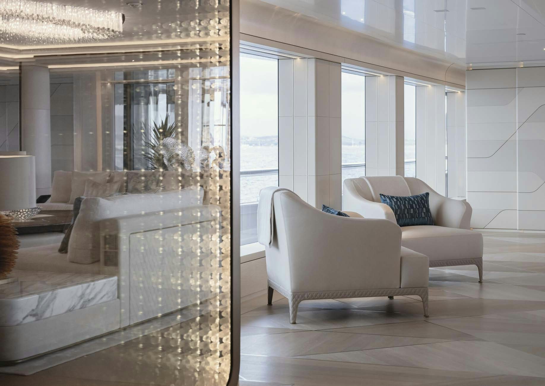 a living room with a large window aboard H3 Yacht for Sale