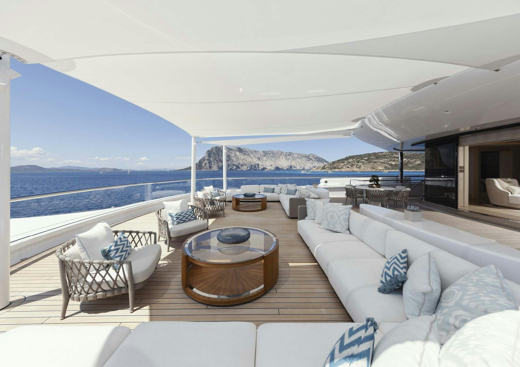 a living room with a large body of water and a large blue sky aboard H3 Yacht for Sale