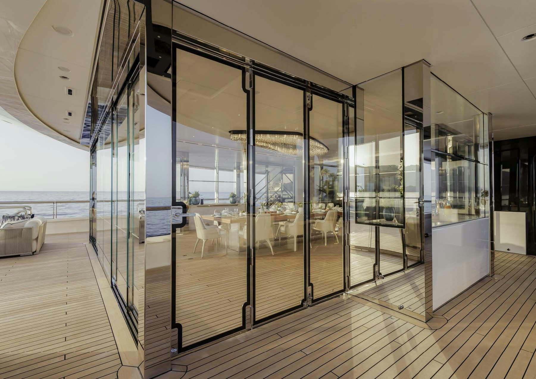 a glass wall with glass doors aboard H3 Yacht for Sale