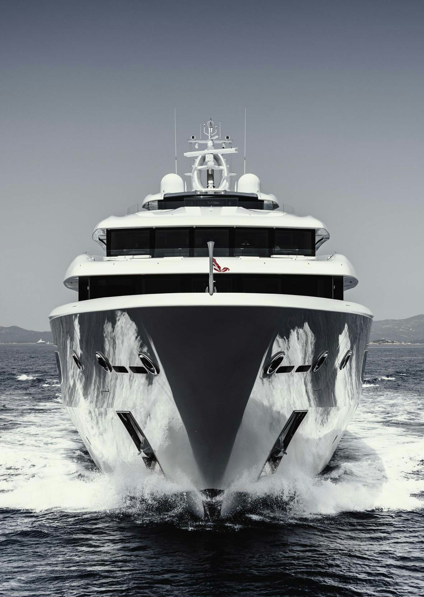 a large ship in the water aboard H3 Yacht for Sale