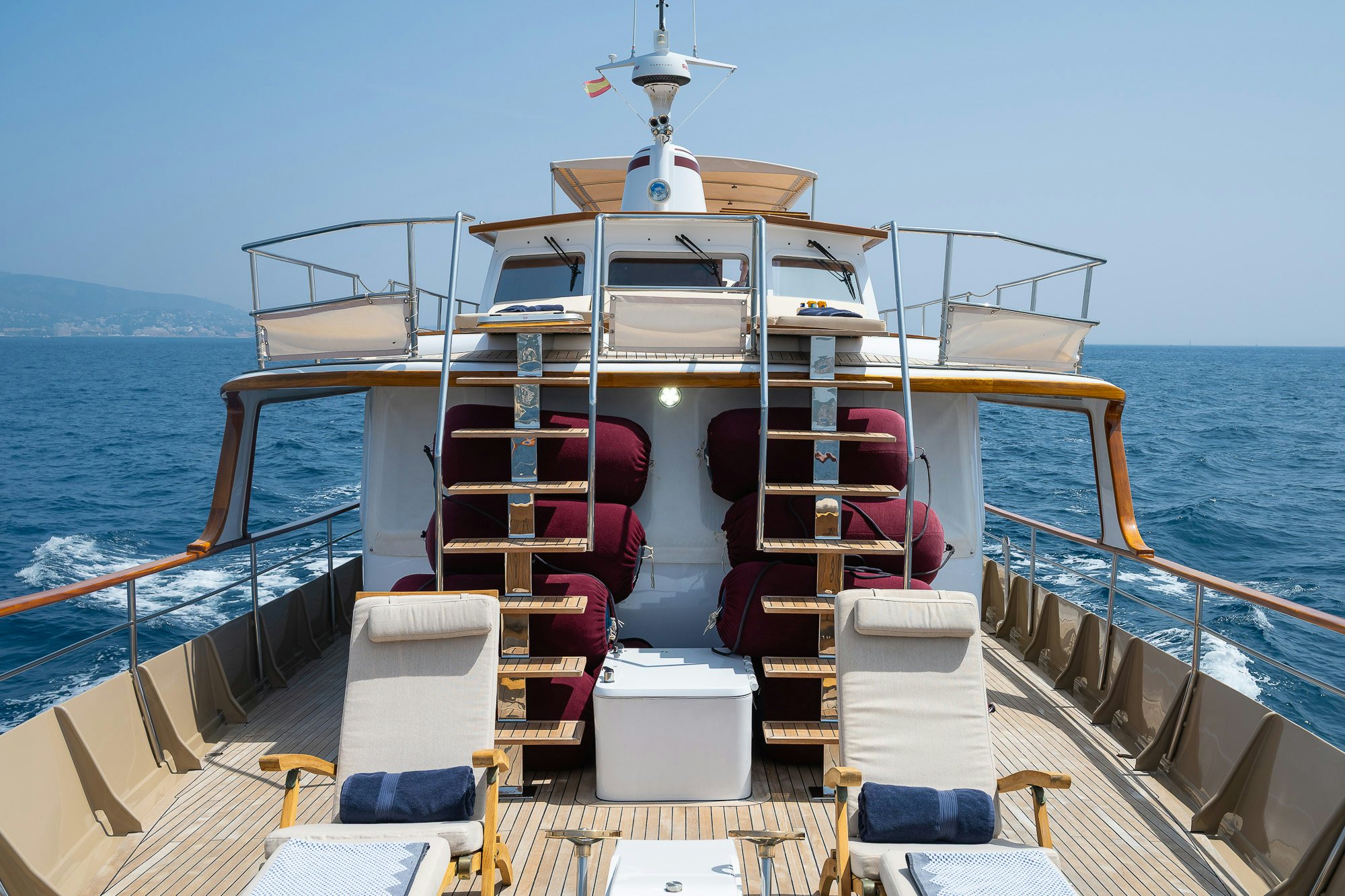 a boat with a deck and chairs on the deck aboard BLACK PEPPER Yacht for Sale