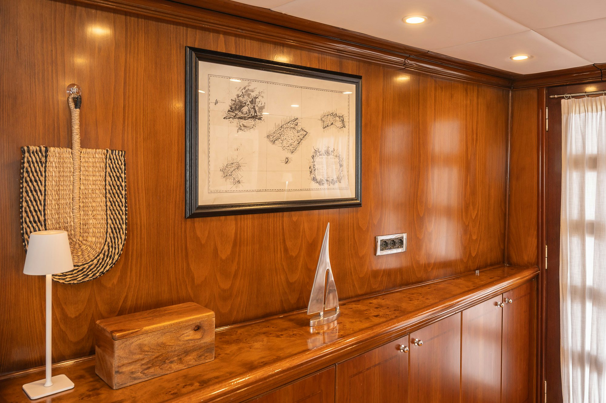 a room with a painting on the wall aboard BLACK PEPPER Yacht for Sale