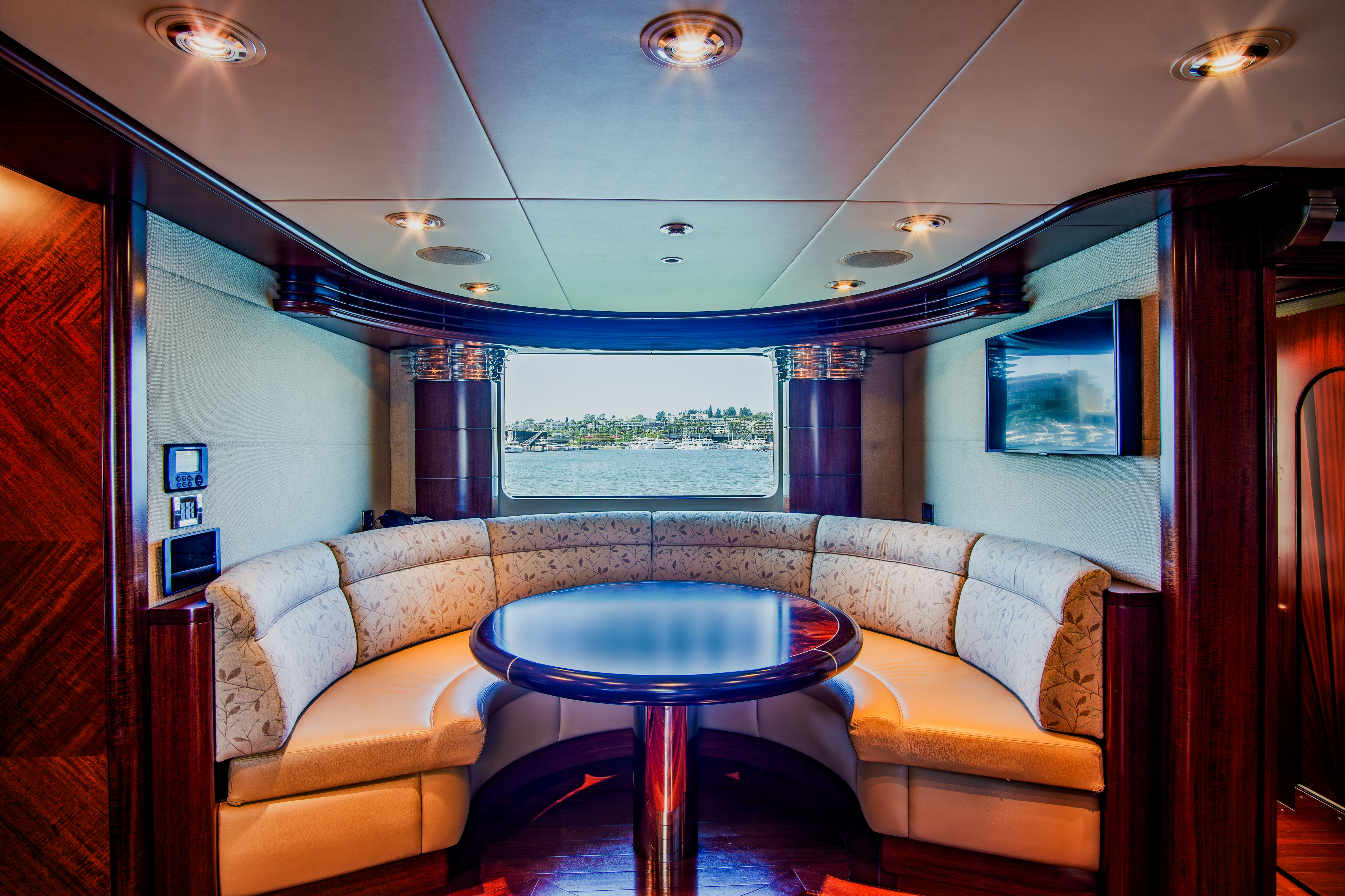 a living room with a couch and a table aboard TRITON Yacht for Charter
