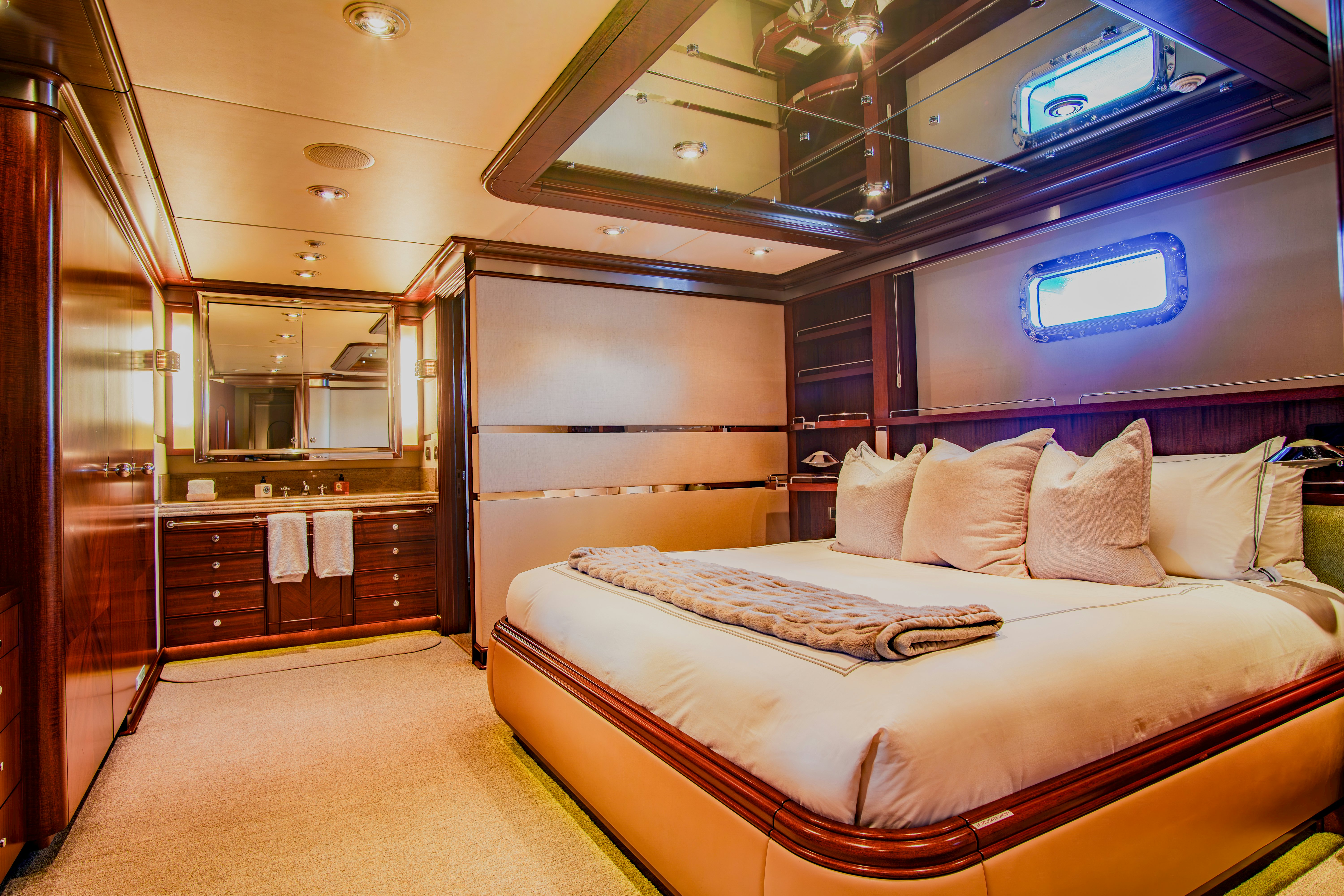 a bed in a room aboard TRITON Yacht for Charter