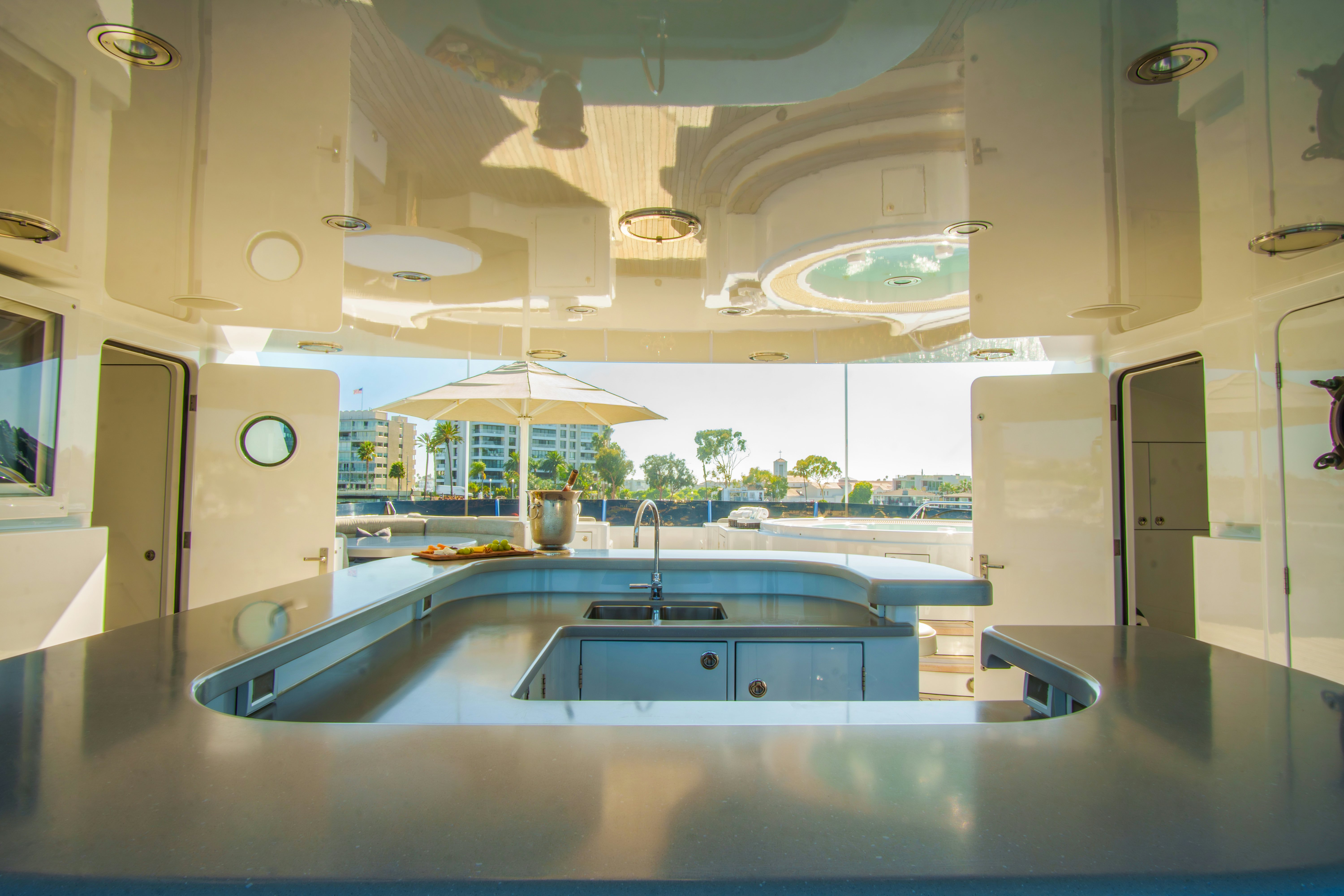 a kitchen with a large island aboard TRITON Yacht for Charter