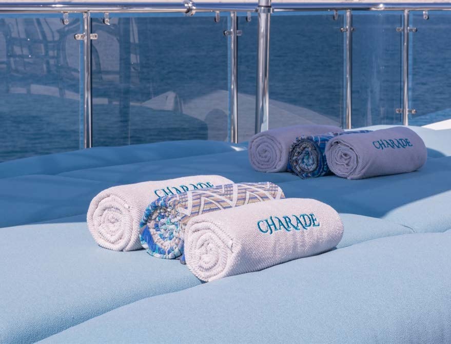 a pair of goggles on a towel on a blue blanket aboard CHARADE Yacht for Charter