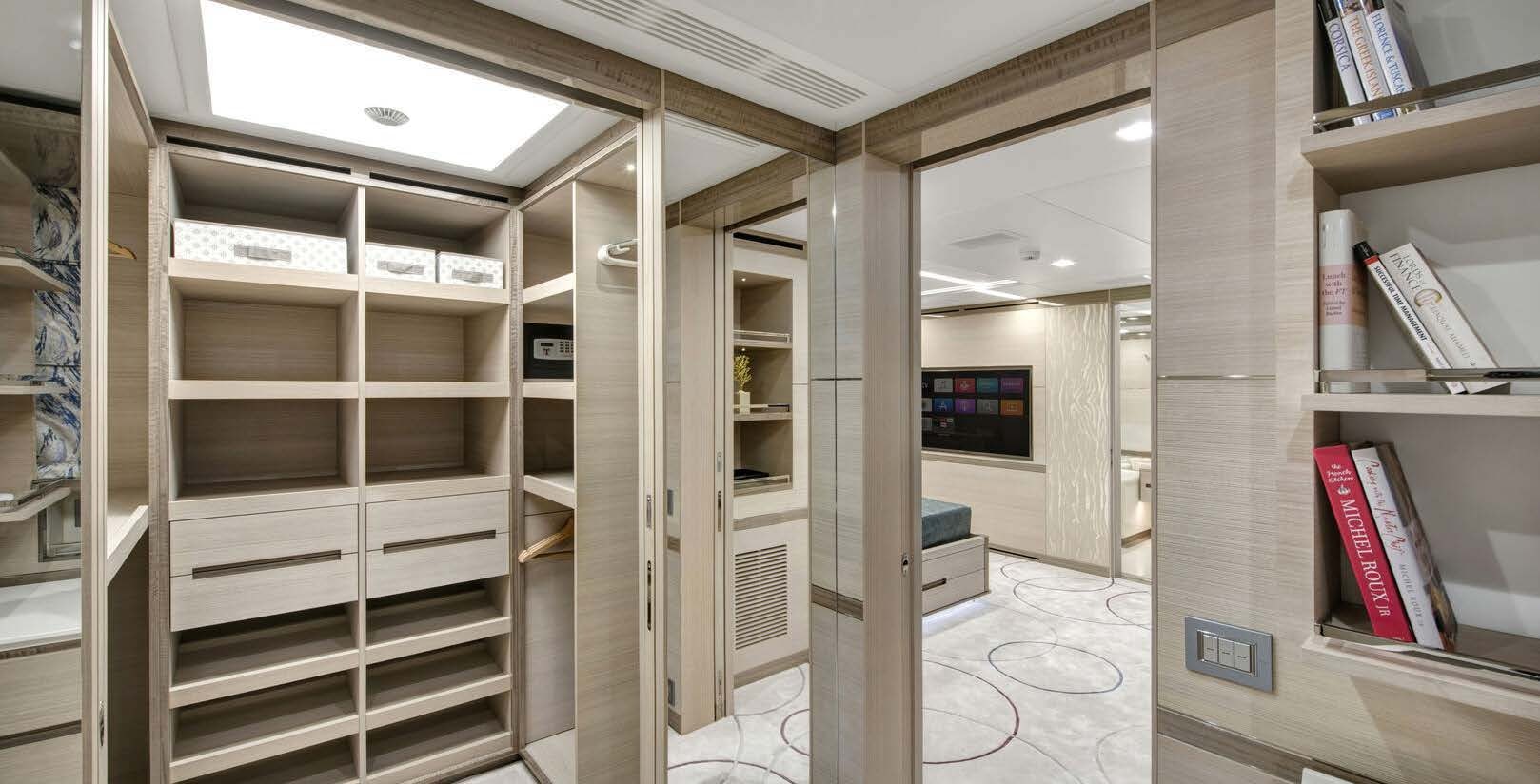 a room with shelves and a computer aboard CHARADE Yacht for Charter