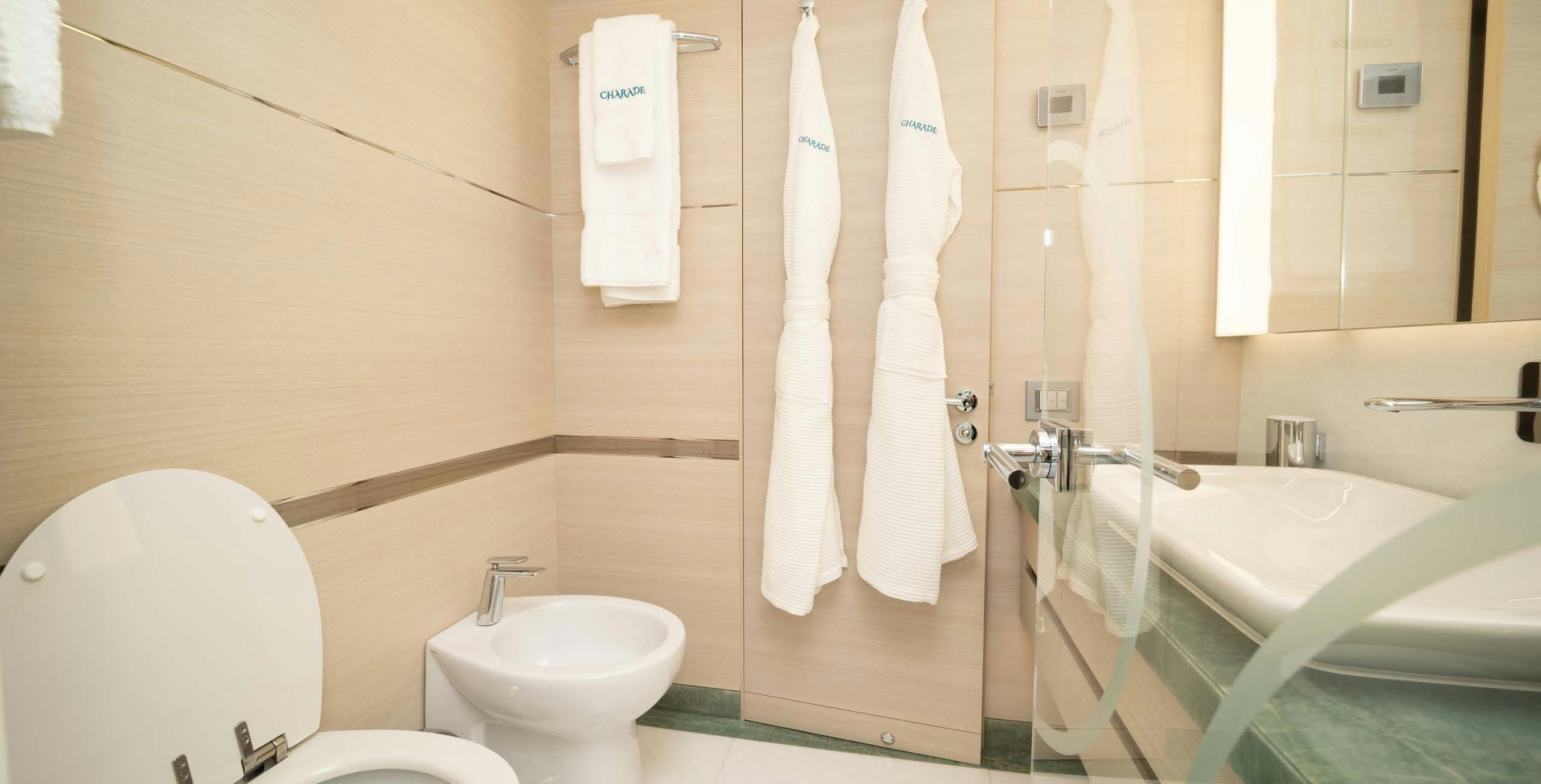 a bathroom with a bathtub toilet and sink aboard CHARADE Yacht for Charter
