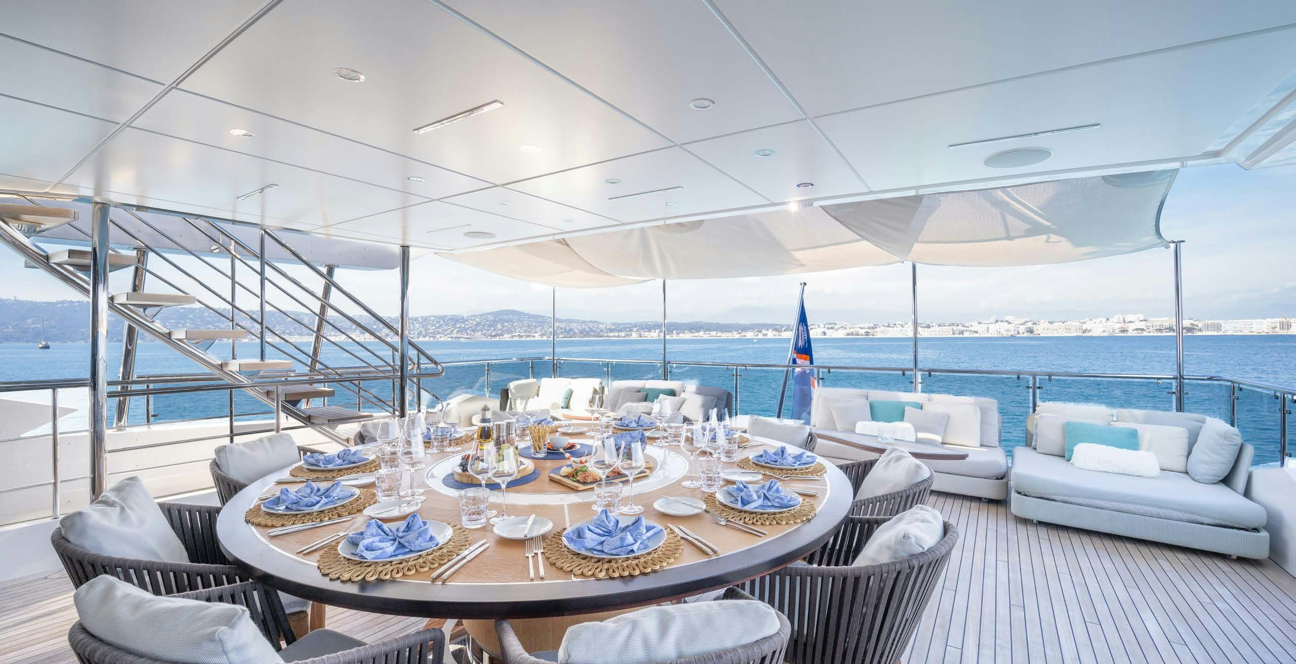 a table set for a meal on a boat aboard CHARADE Yacht for Charter