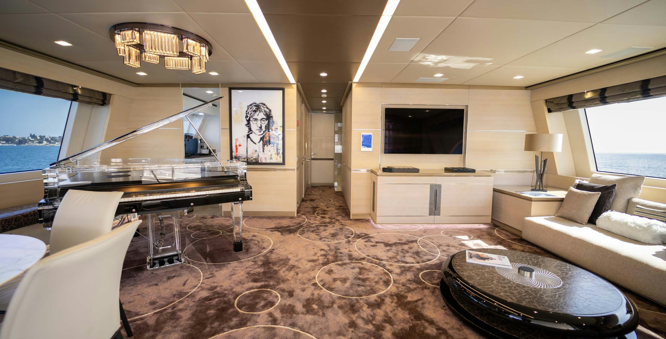 a living room with a large television aboard CHARADE Yacht for Charter