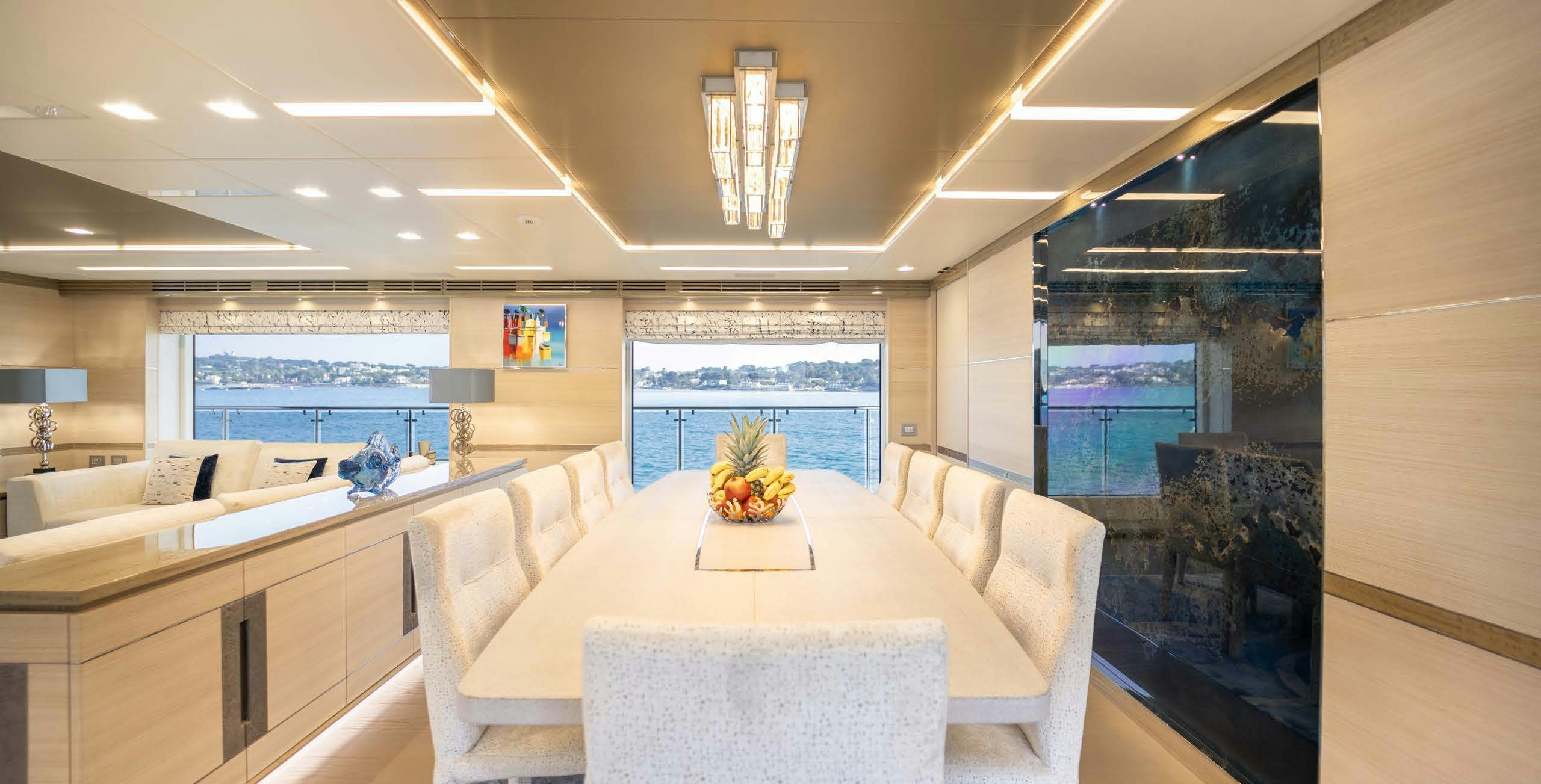a large room with a table and chairs aboard CHARADE Yacht for Charter