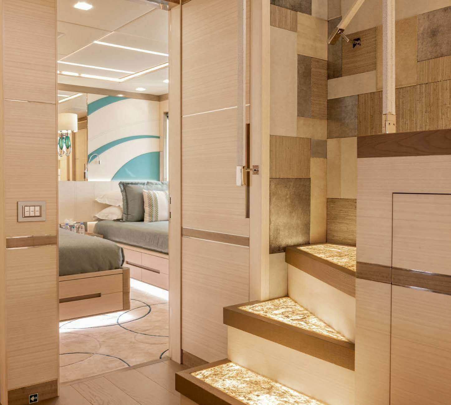 a room with a staircase and a couch aboard CHARADE Yacht for Charter