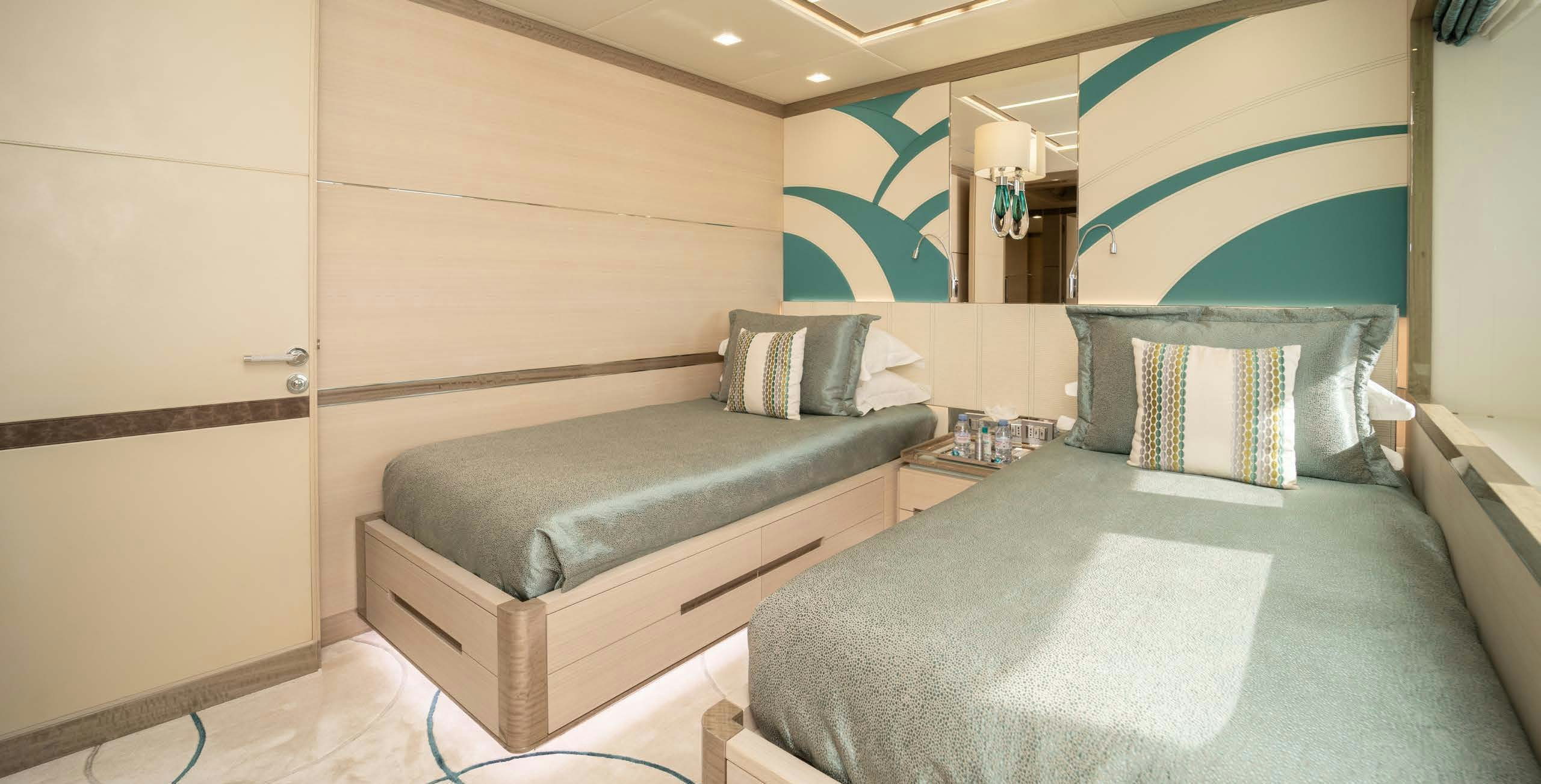 a room with a bed and a couch aboard CHARADE Yacht for Charter