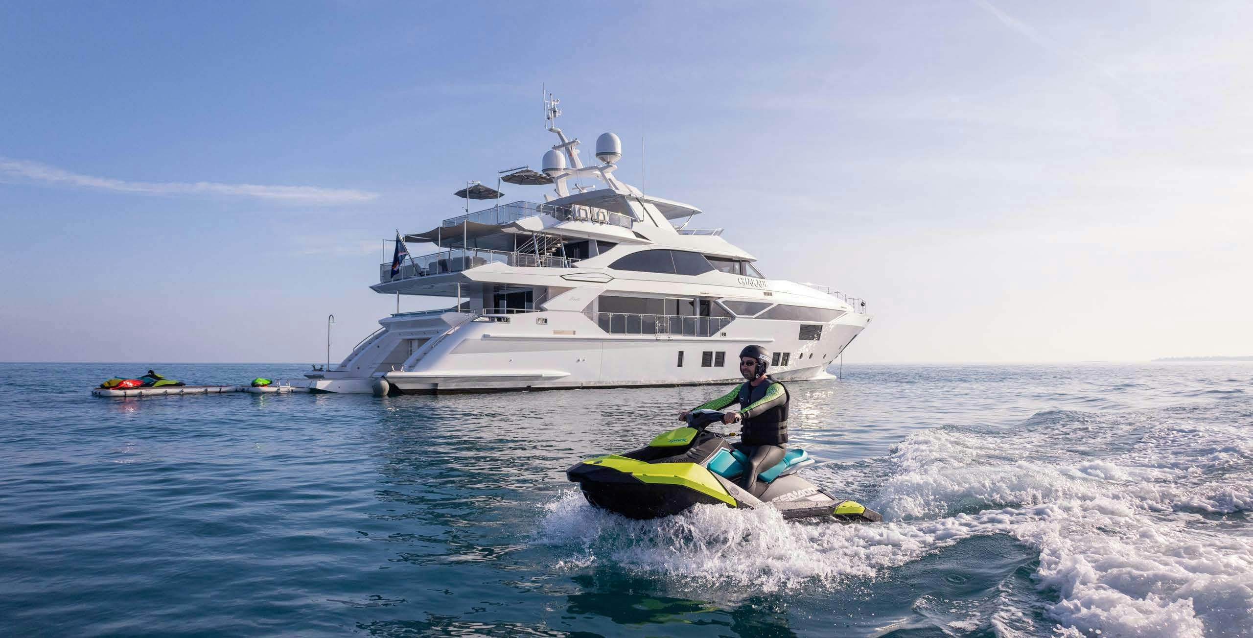 a boat in the water with a person on it aboard CHARADE Yacht for Charter
