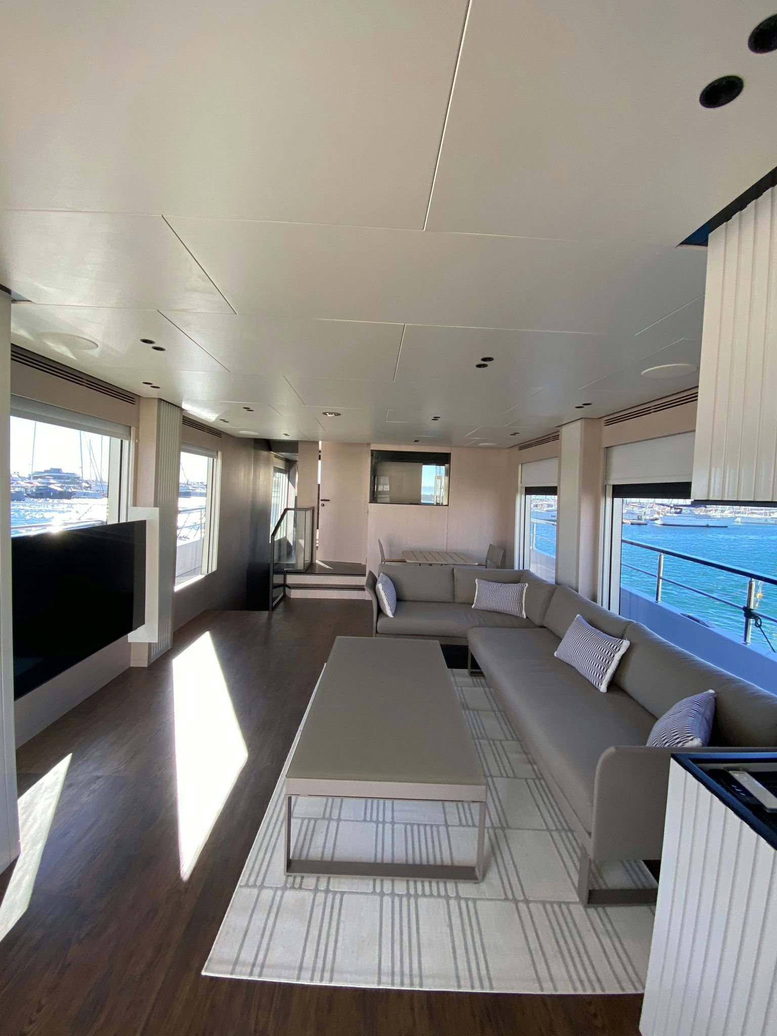 a living room with a large pool aboard ZIMA Yacht for Sale