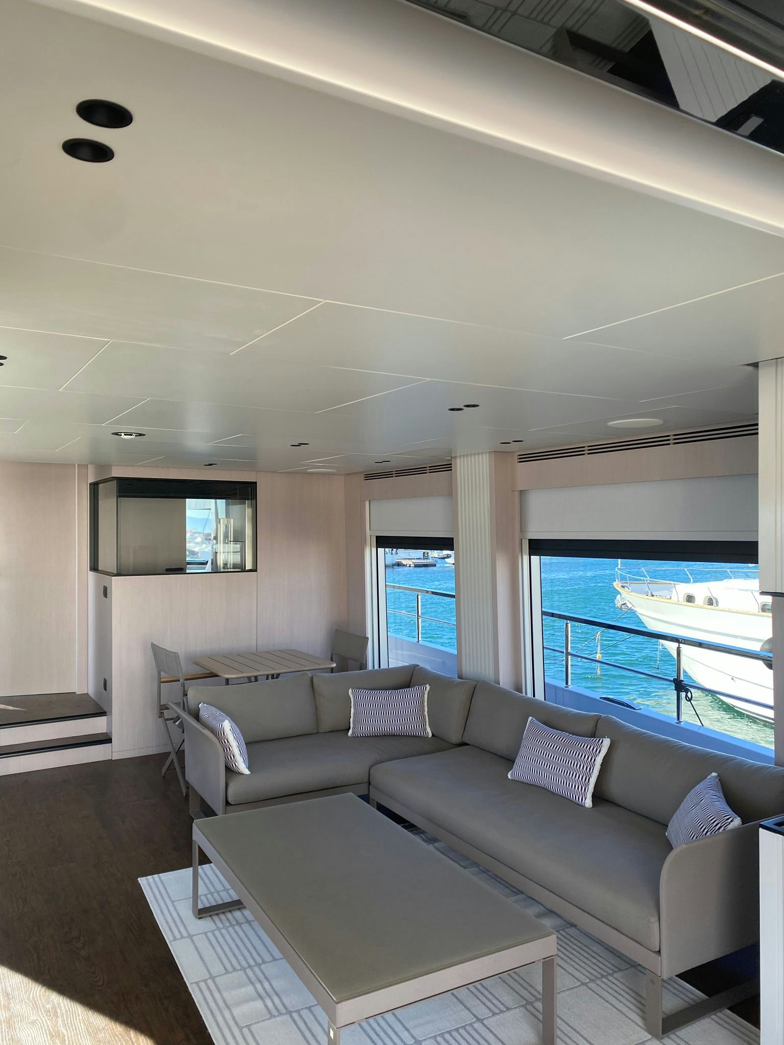 a living room with a large pool aboard ZIMA Yacht for Sale