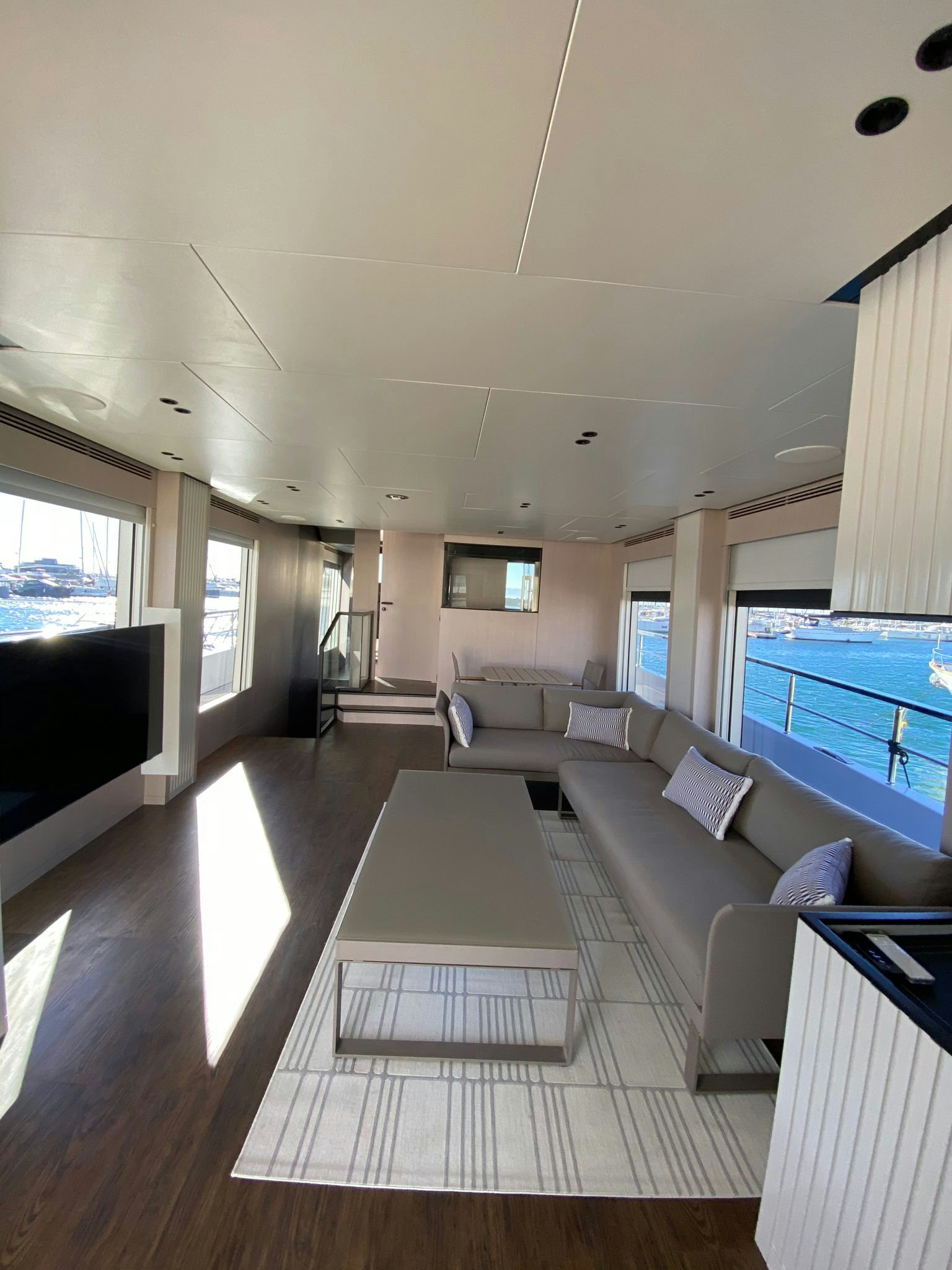 a living room with a large pool aboard ZIMA Yacht for Sale