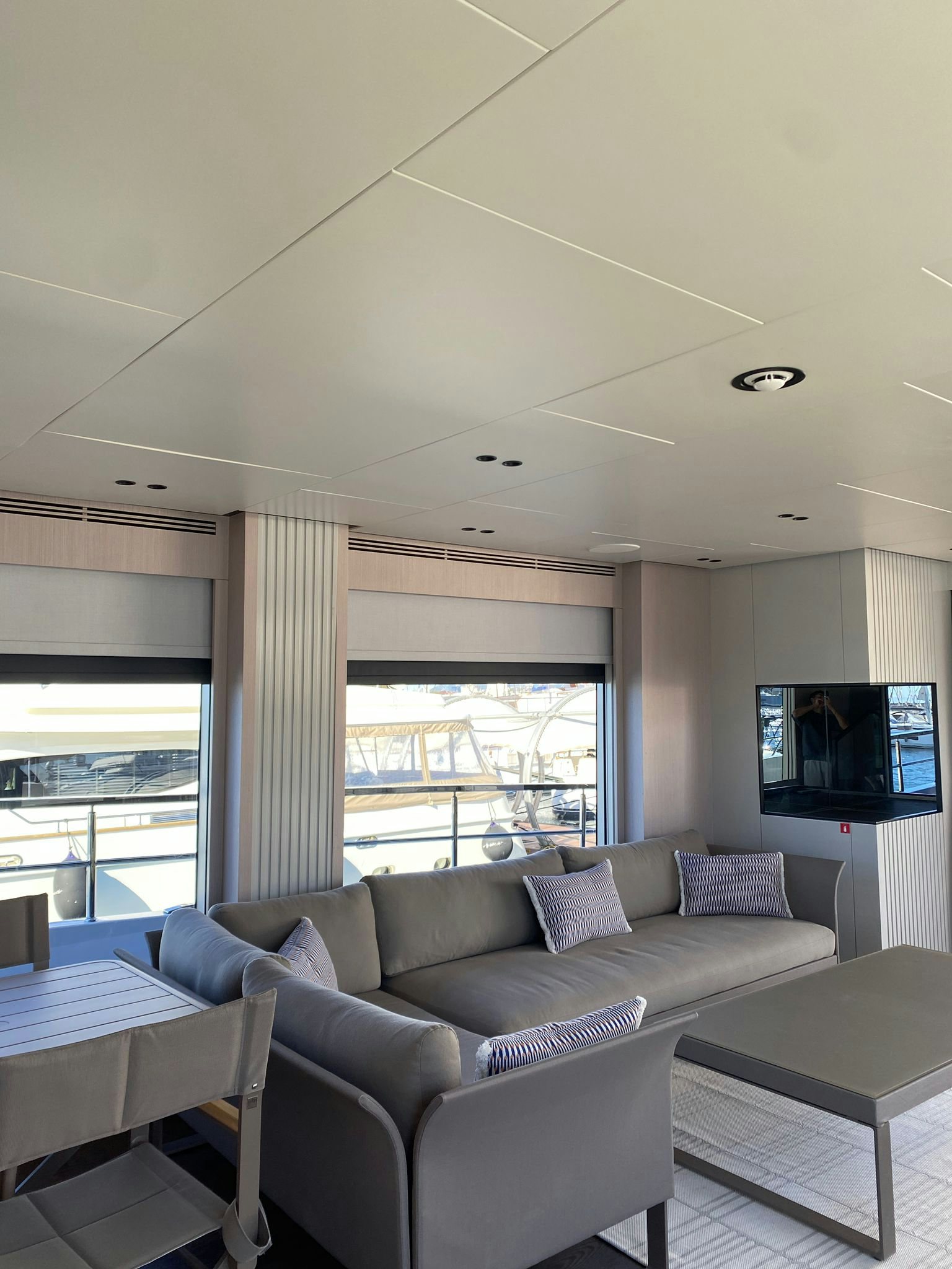 a living room with a large window aboard ZIMA Yacht for Sale