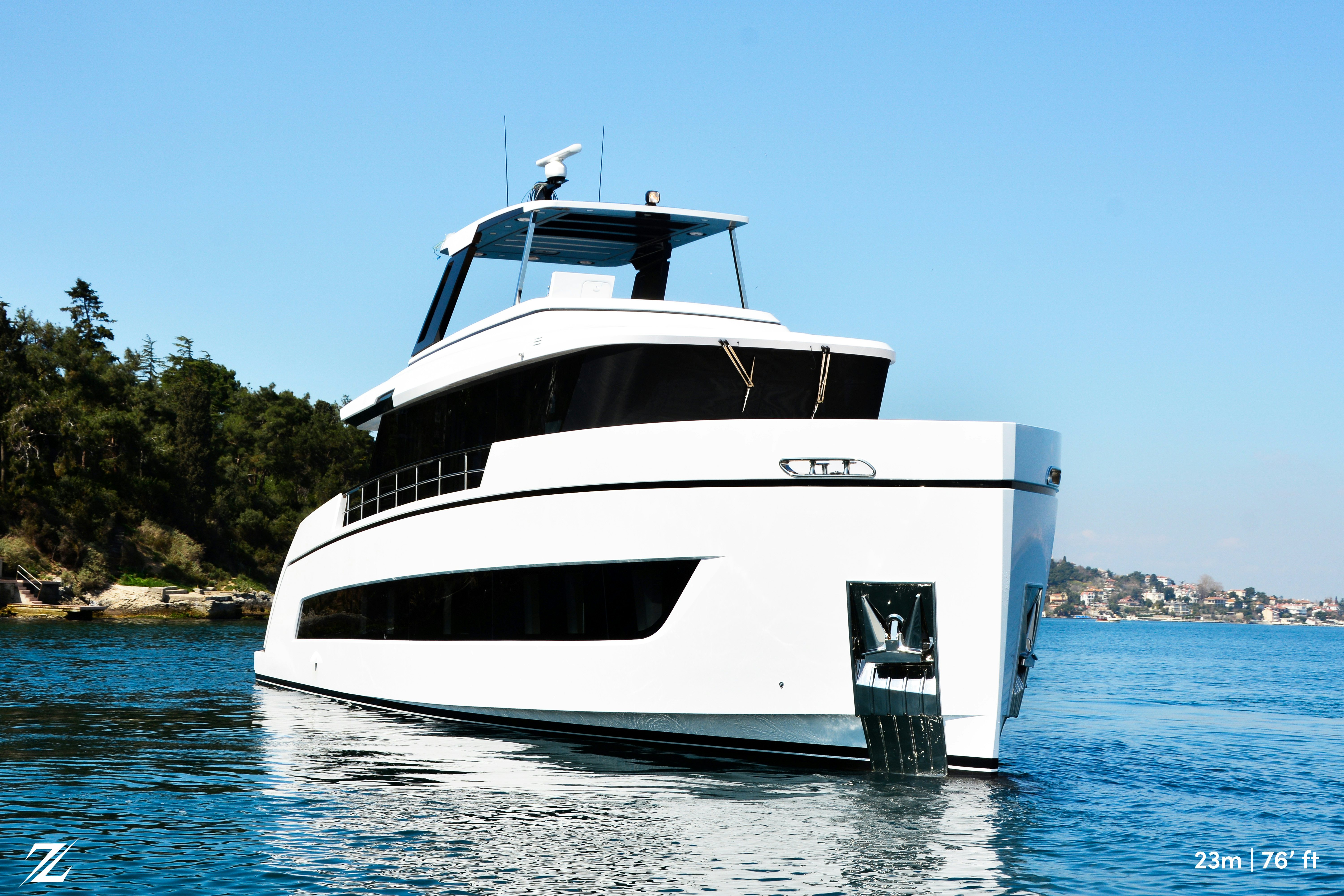 a white boat on the water aboard ZIMA Yacht for Sale
