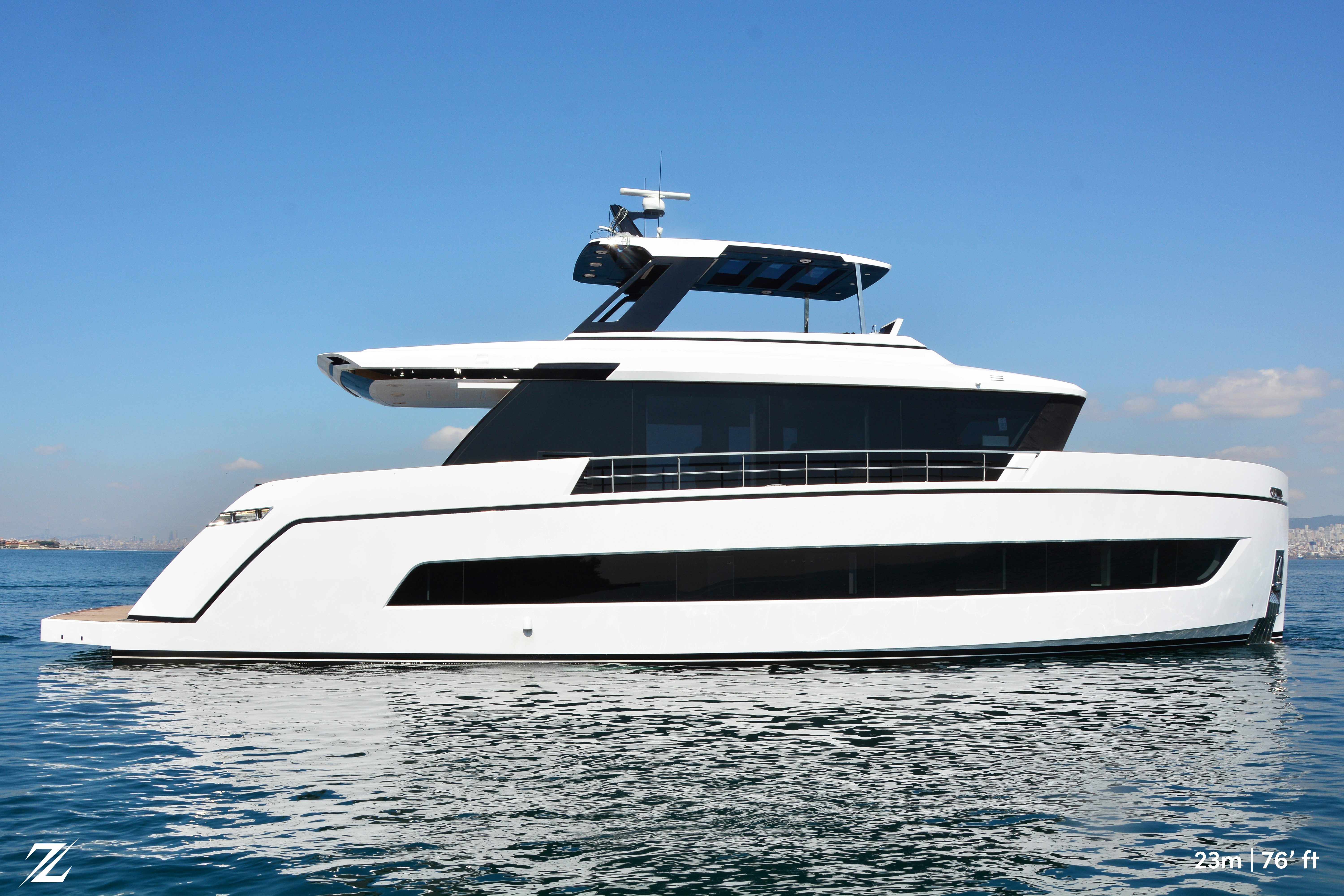a white yacht on the water aboard ZIMA Yacht for Sale