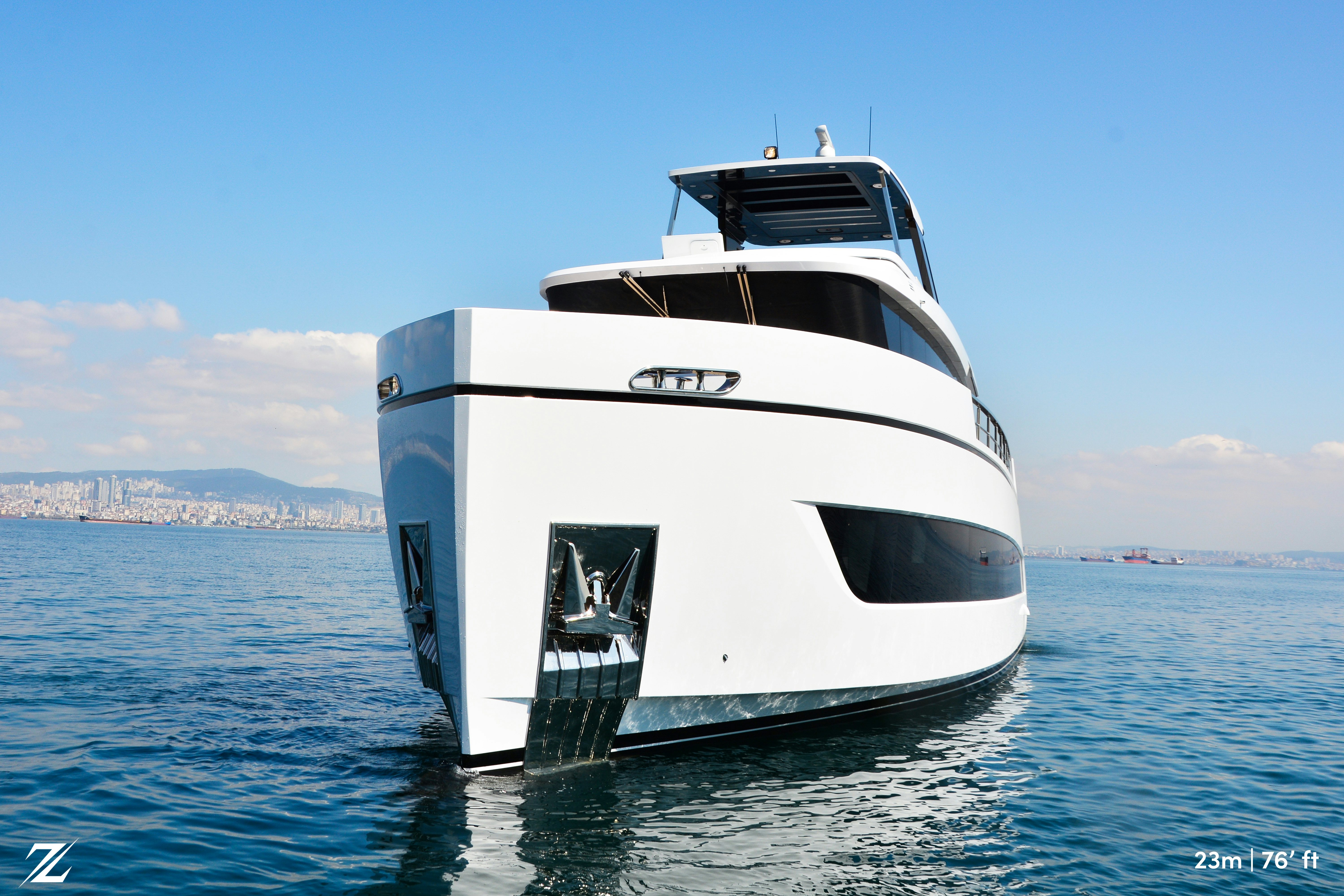 a white boat in the water aboard ZIMA Yacht for Sale