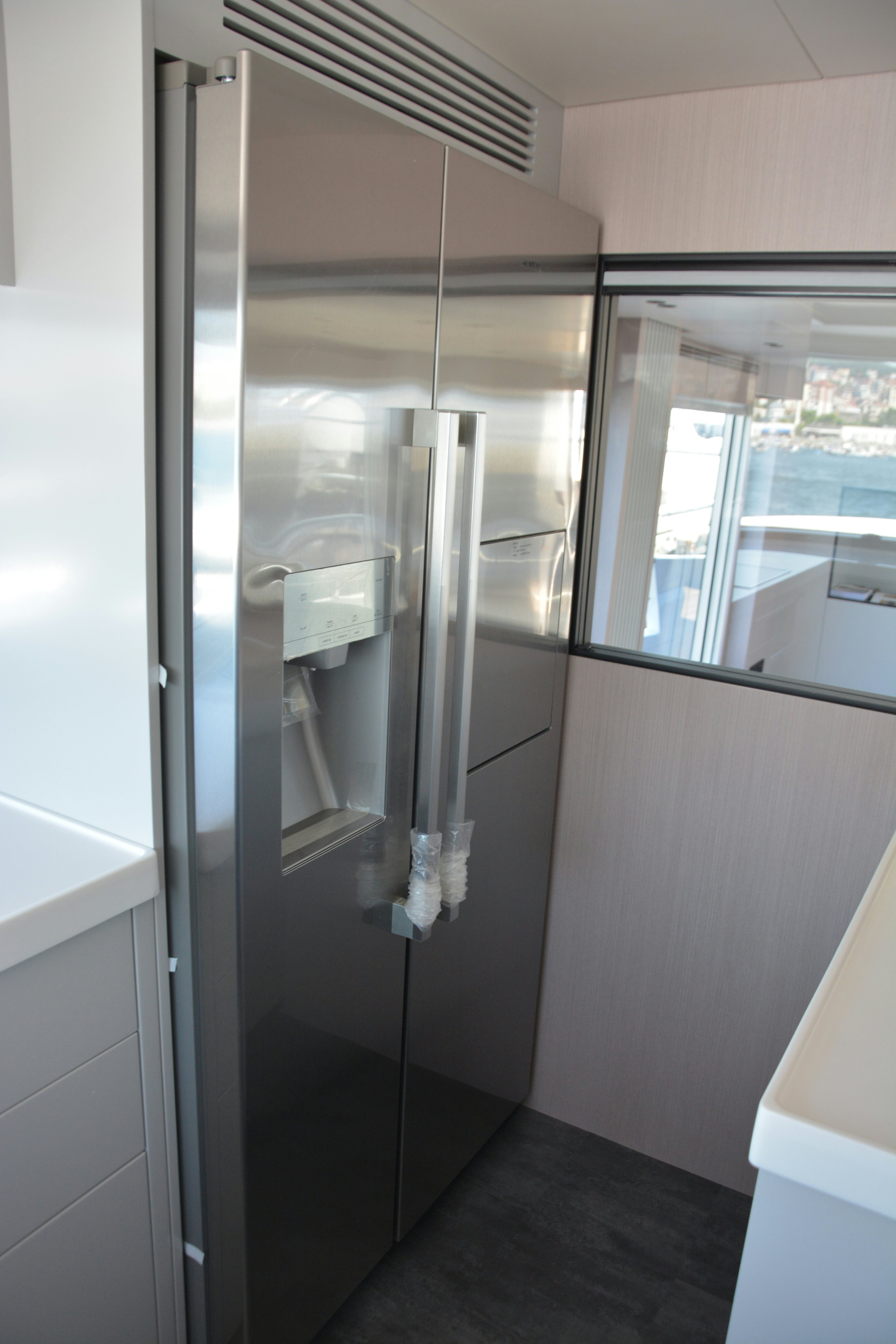 a glass shelf with a light inside aboard ZIMA Yacht for Sale