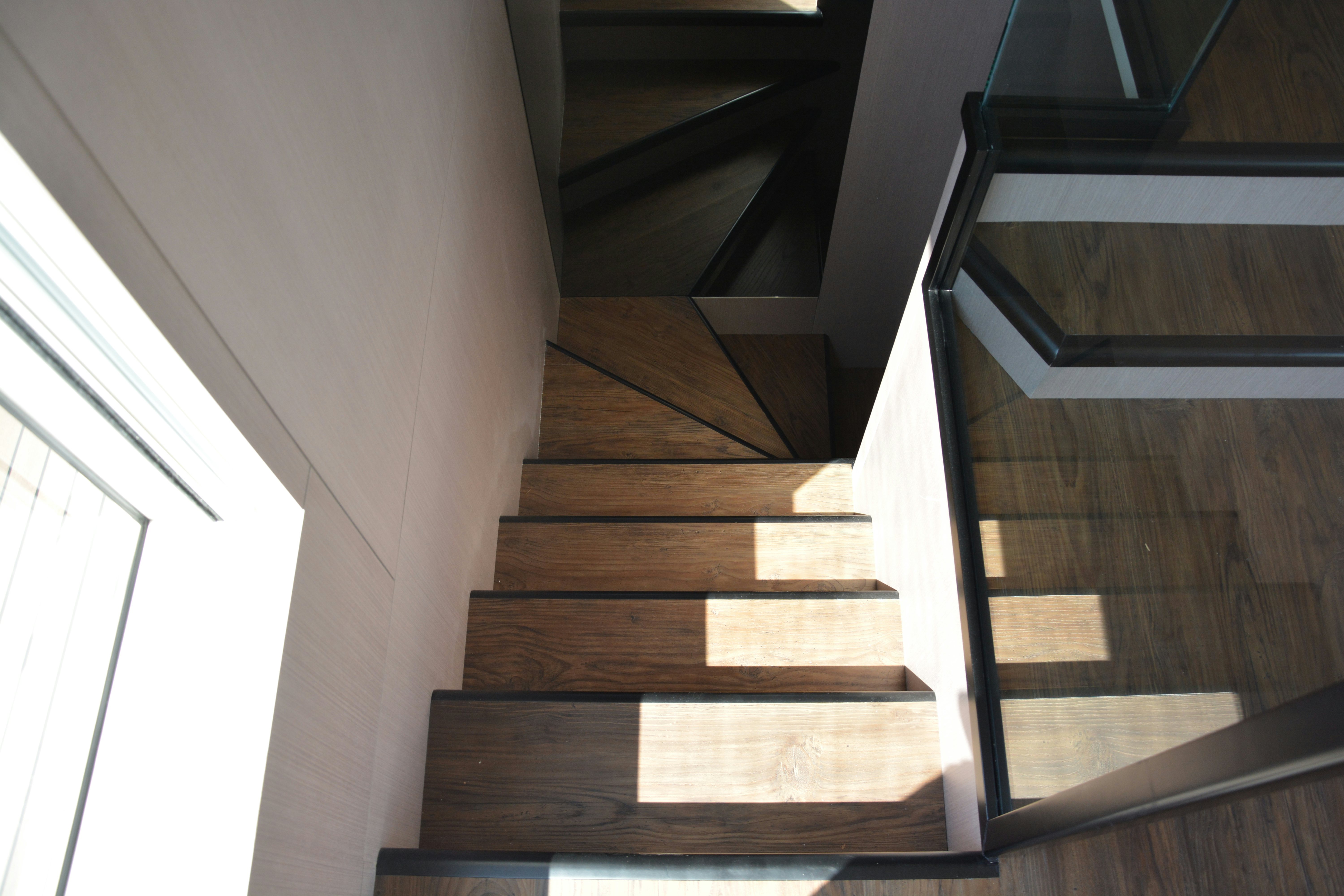 a wooden staircase in a building aboard ZIMA Yacht for Sale