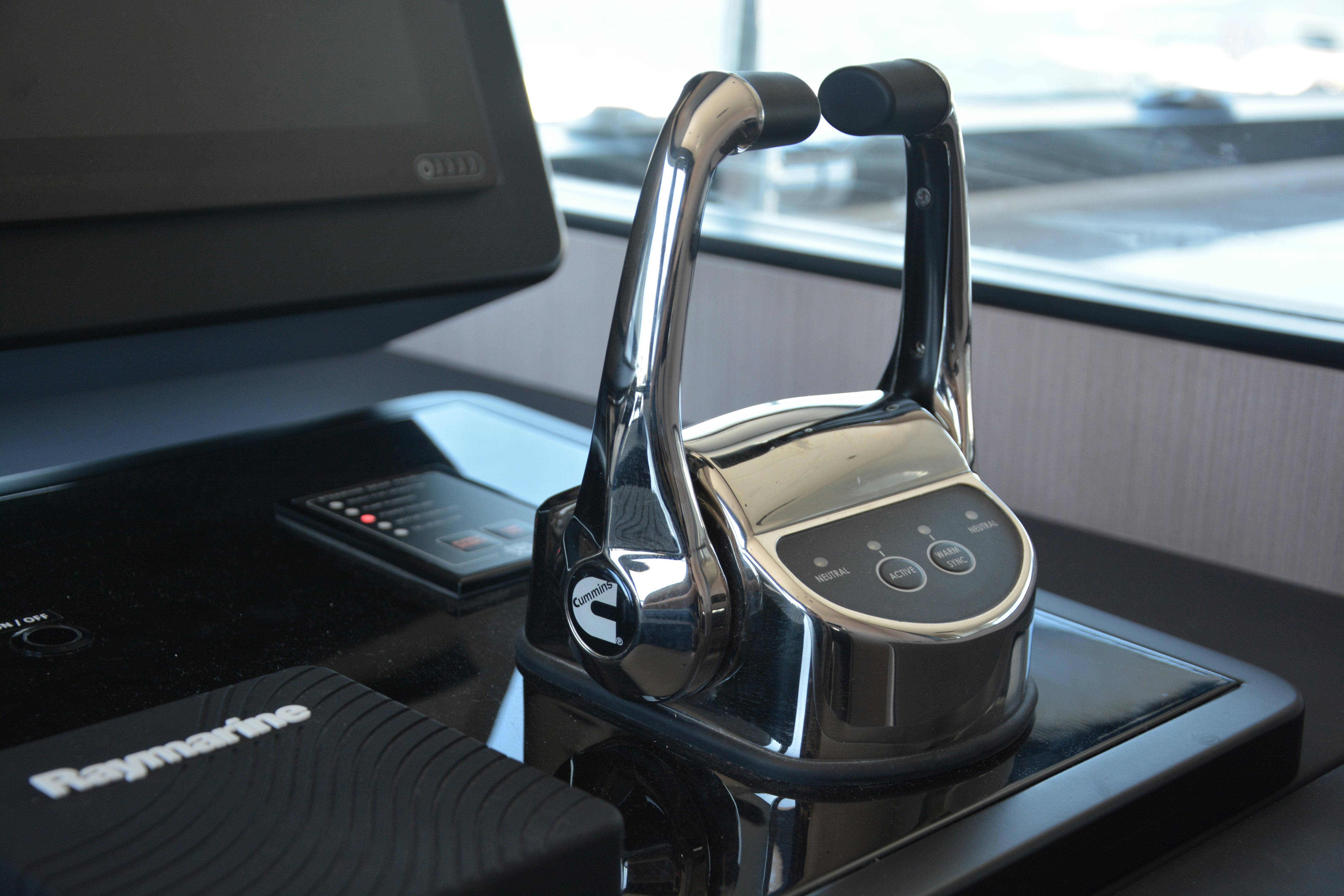 a car with a steering wheel aboard ZIMA Yacht for Sale