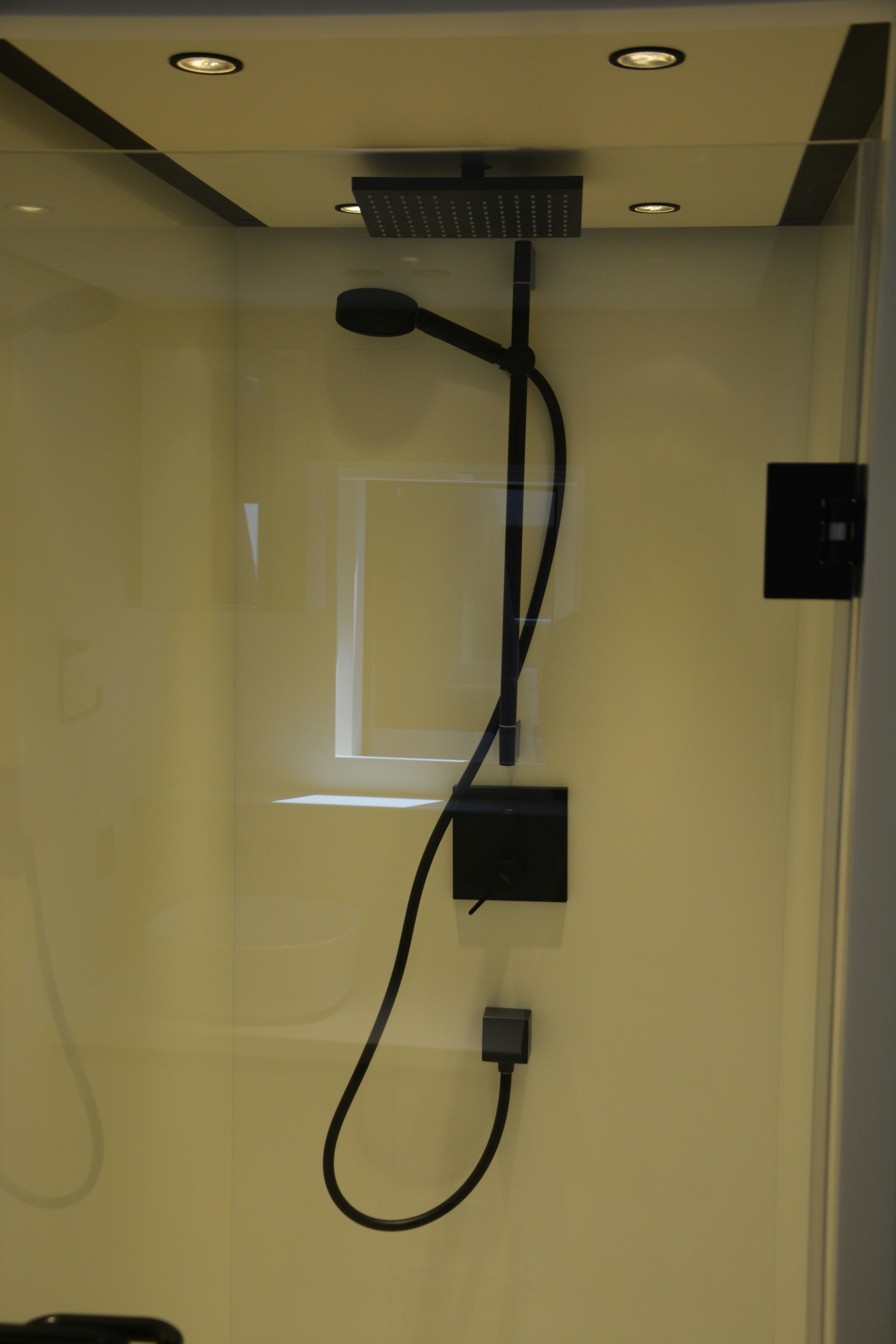 a black headphones on a white wall aboard ZIMA Yacht for Sale