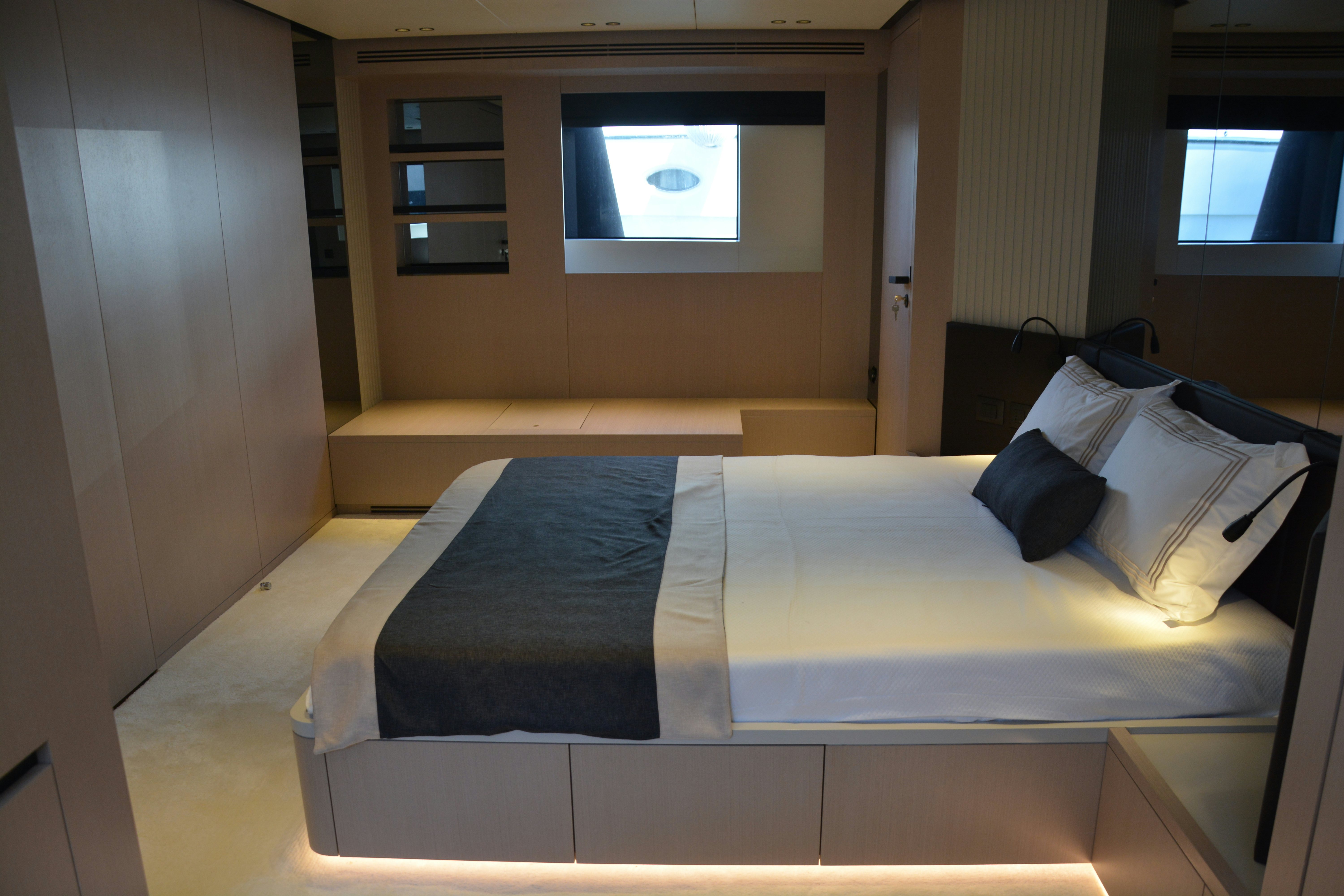 a bed in a room aboard ZIMA Yacht for Sale