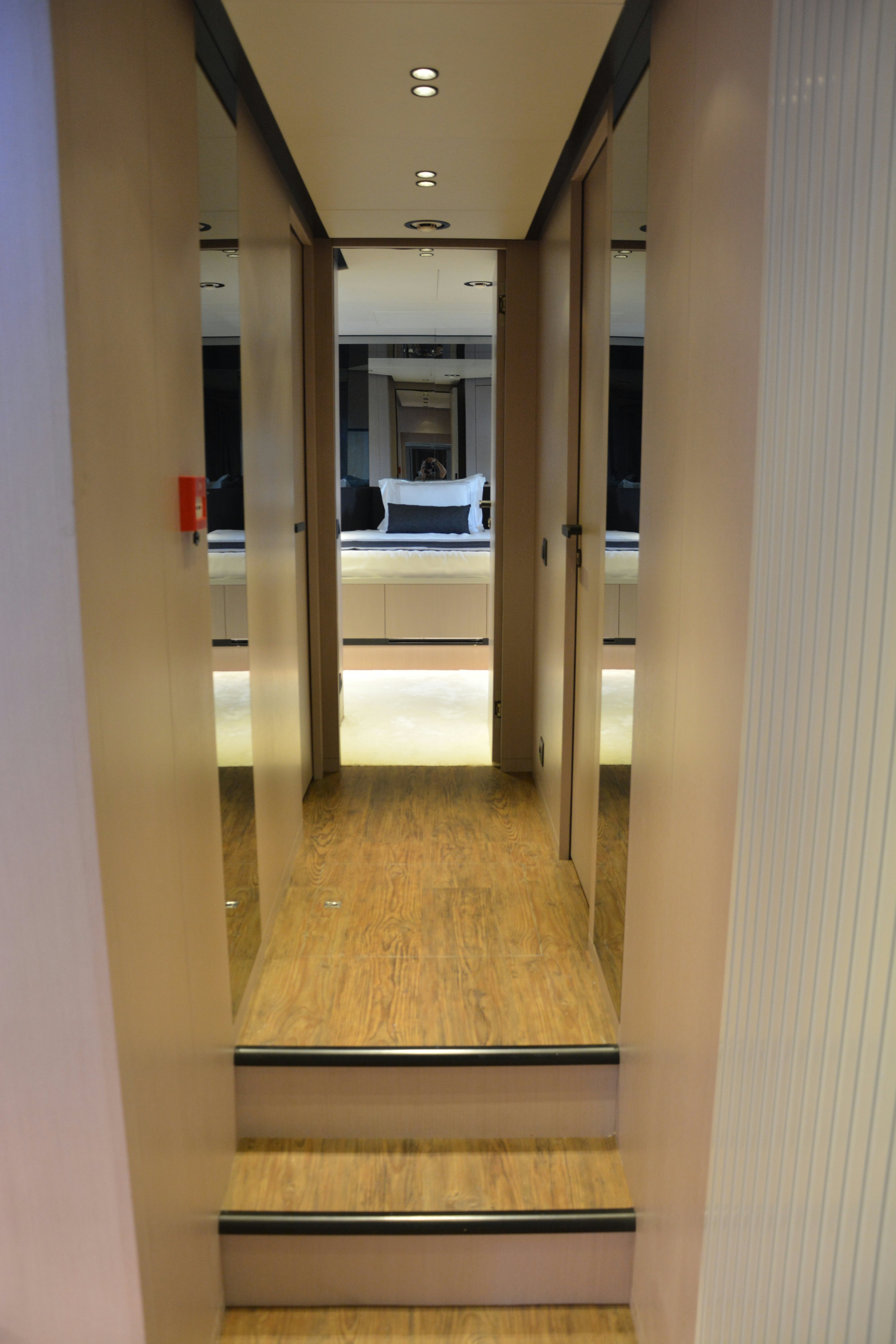 a room with a wood floor and cabinets aboard ZIMA Yacht for Sale